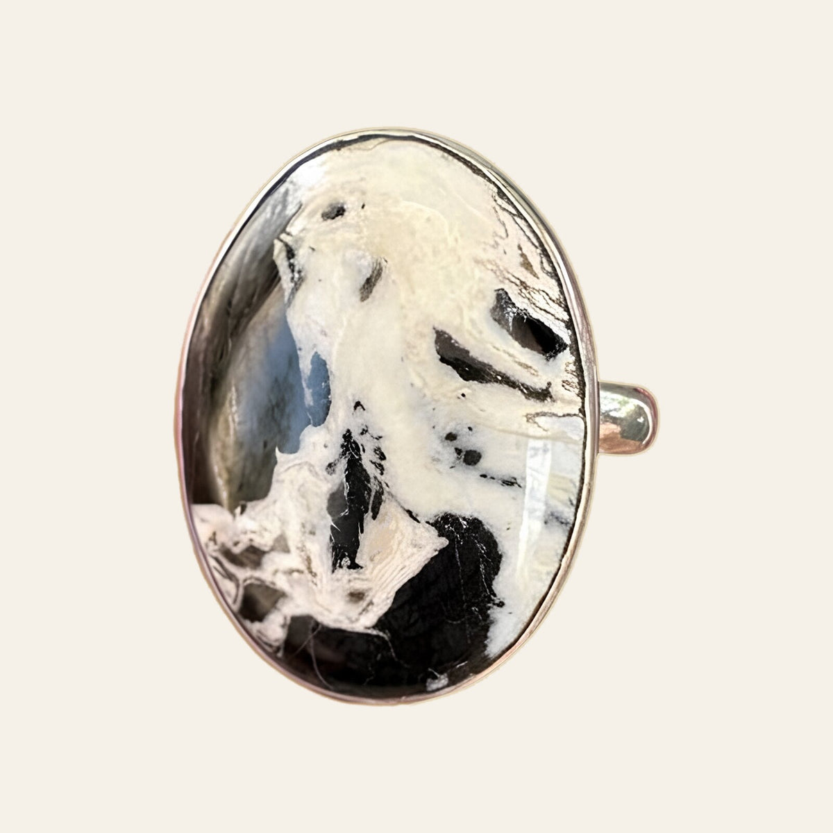 White Buffalo Stone Ring in Sterling Silver, Size 7.5, shown on a cream background