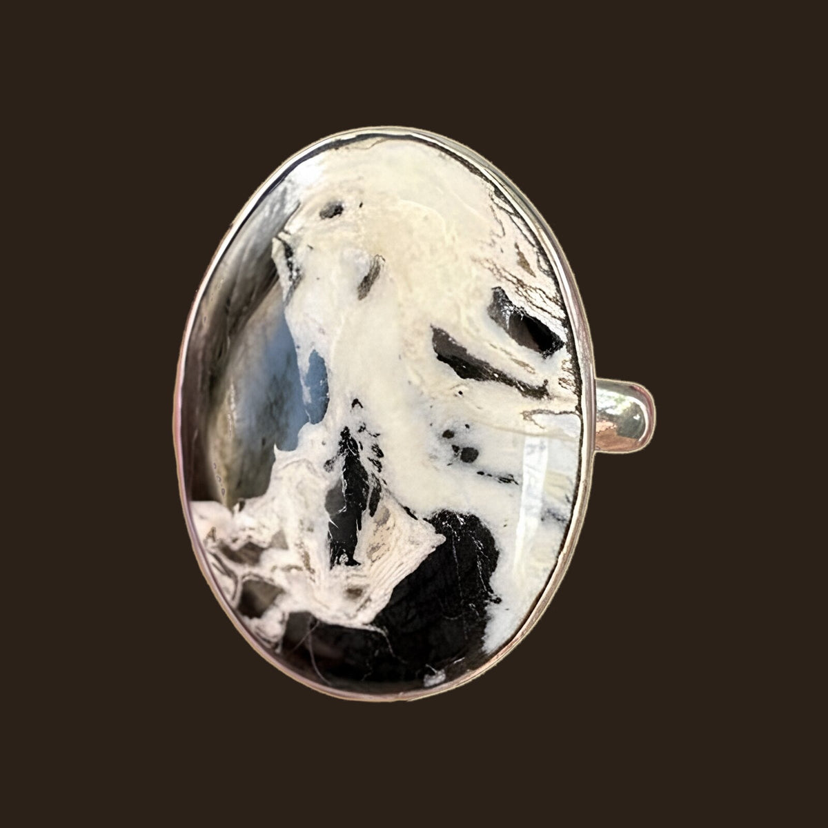 White Buffalo Stone Ring in Sterling Silver, Size 7.5, shown on an espresso background