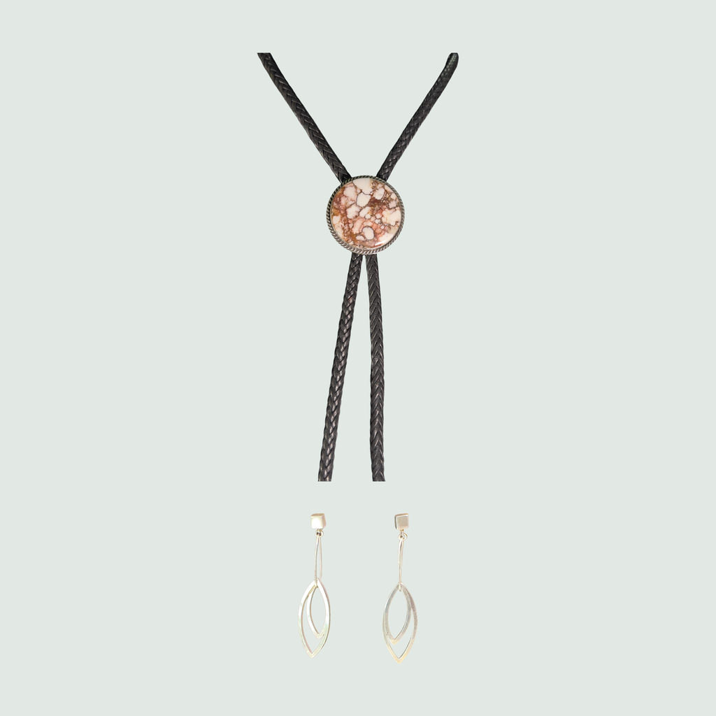 Wild horse bolo tie and leaf dangle earrings jewelry set in sterling silver, shown on a sage mist background