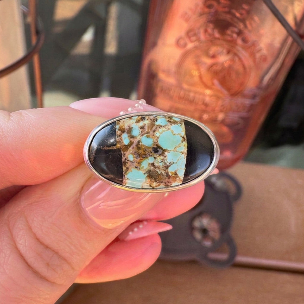 Wildflower Artisans sterling silver ring featuring a Black Jack turquoise stone with bold black matrix patterns.