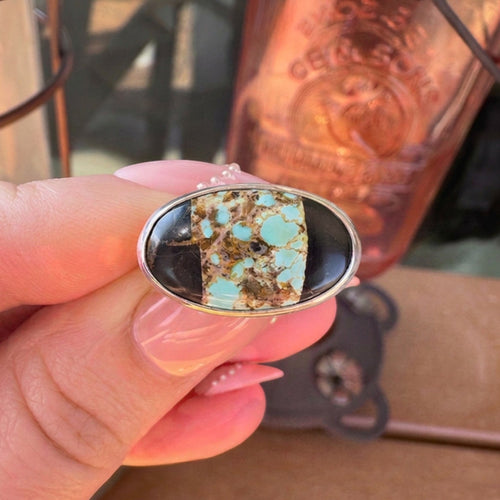 Wildflower Artisans sterling silver ring featuring a Black Jack turquoise stone with bold black matrix patterns.