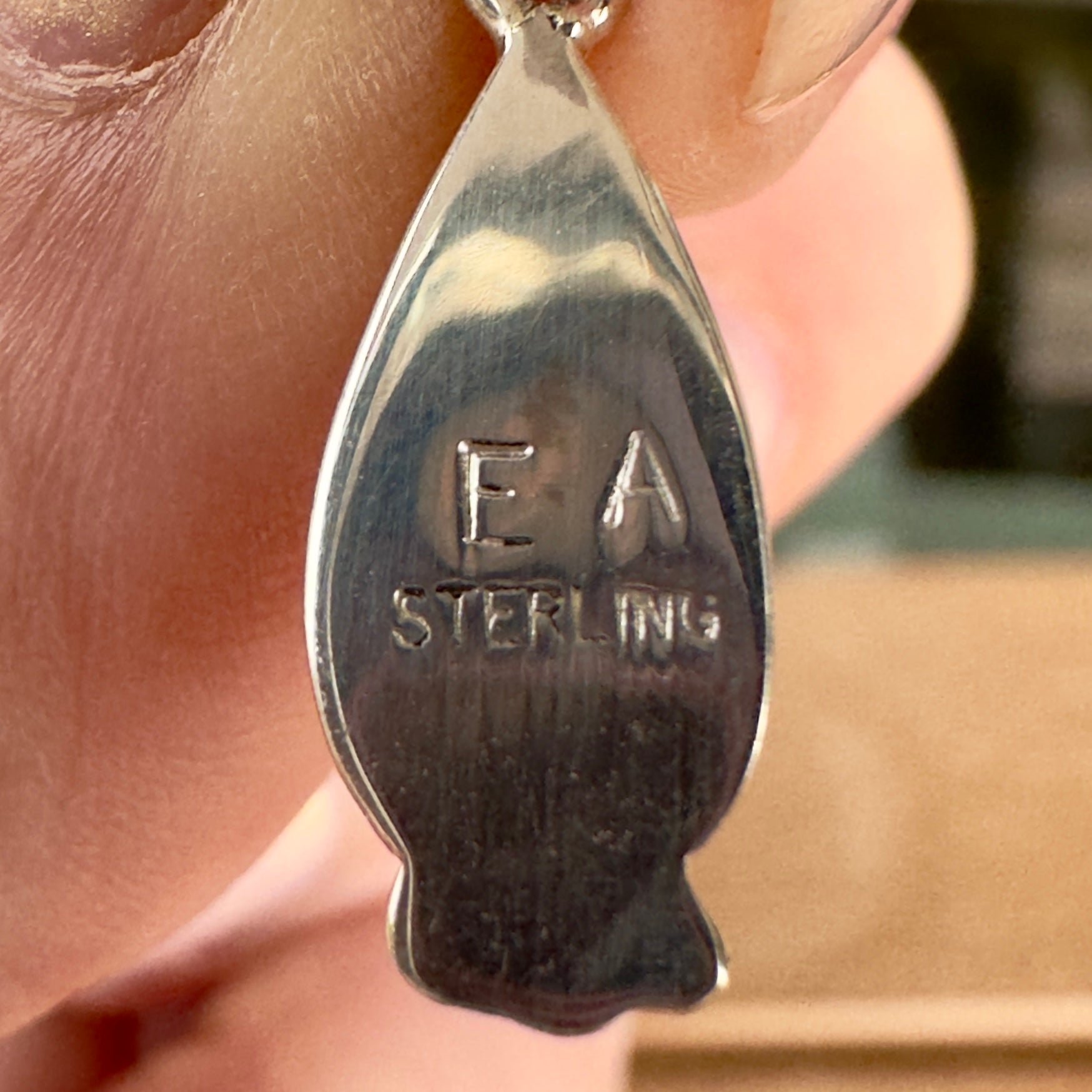 Wildflower Artisans EA sterling silver hallmark on the back of a Sonoran Mountain turquoise teardrop earring