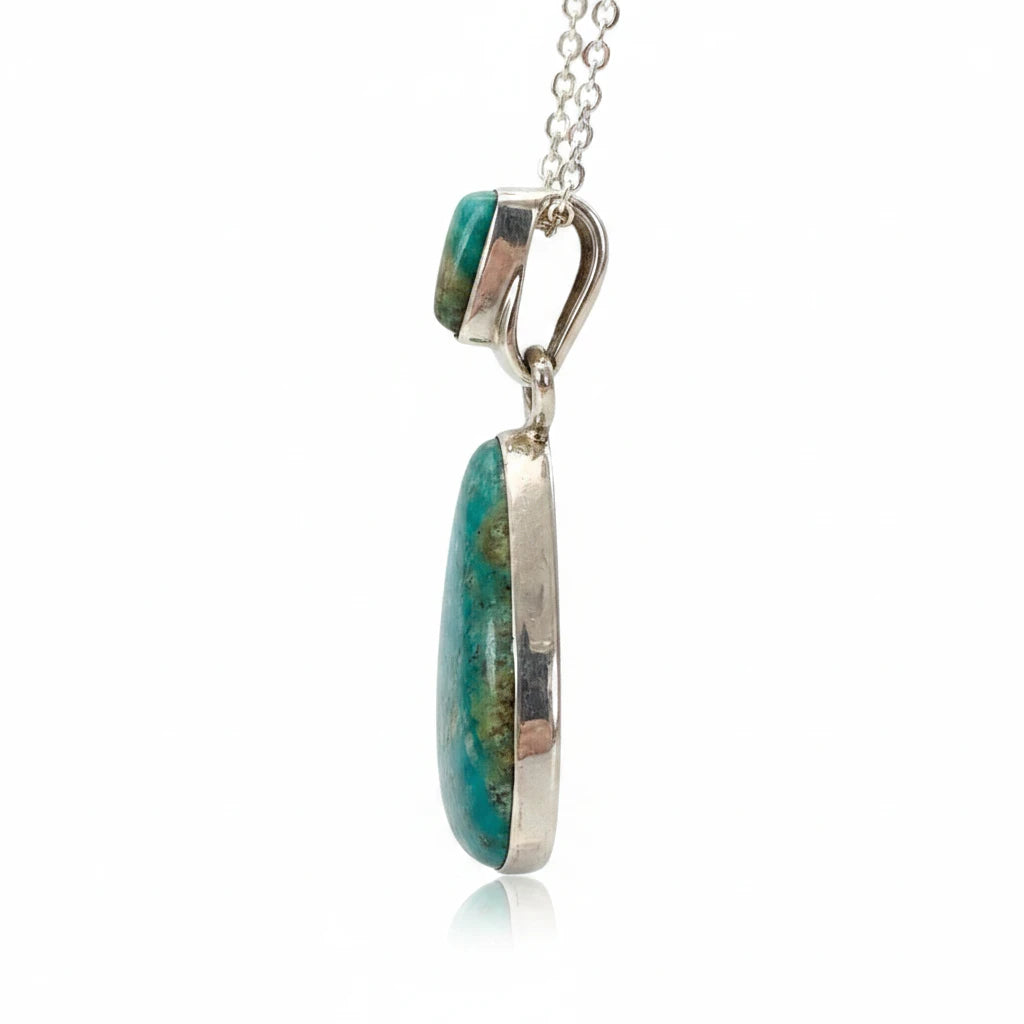 Wildflower Artisans Martinez Fox turquoise teardrop pendant in sterling silver, side view showing bezel and bail