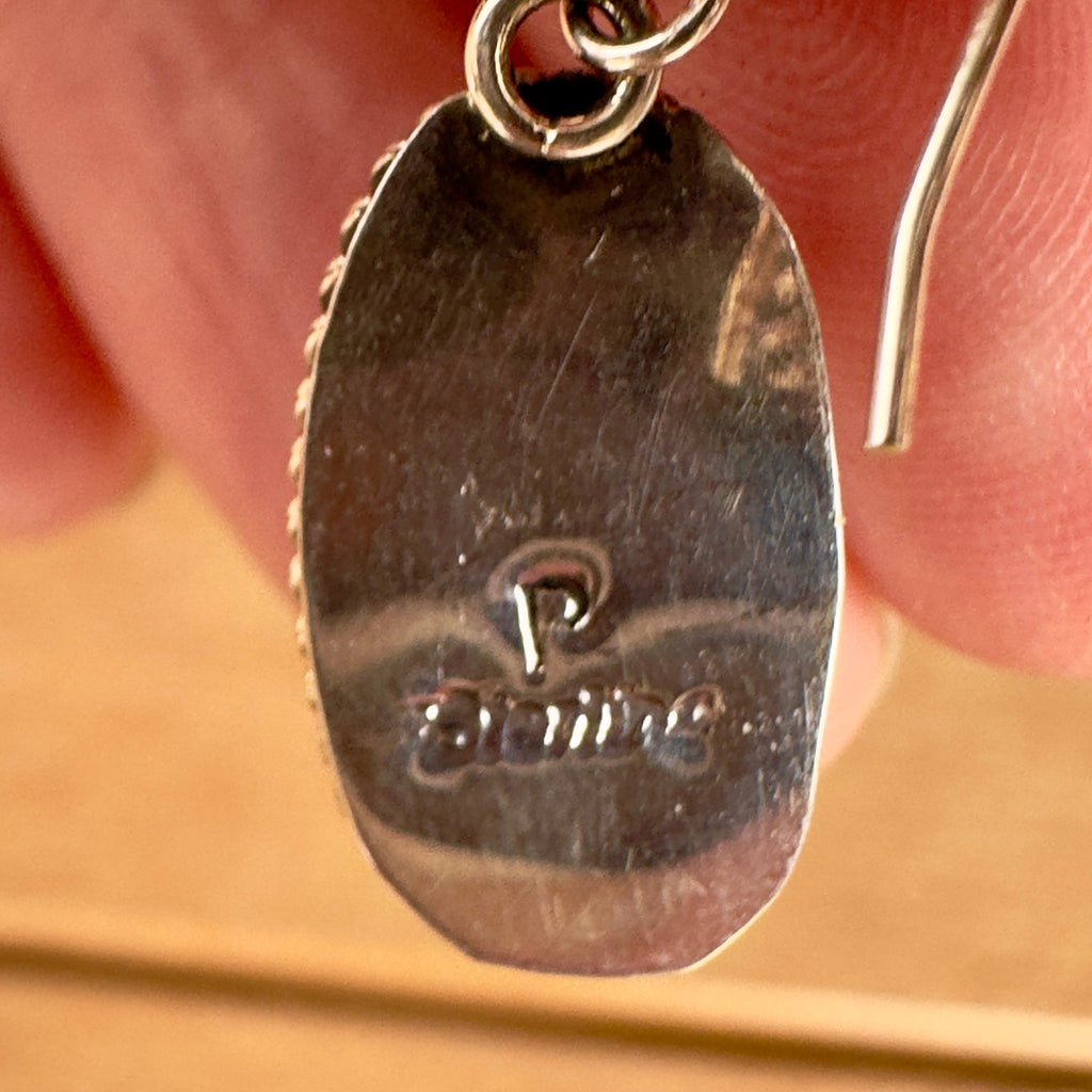 Wildflower Artisans sterling silver earring back showing the P hallmark and sterling stamp on an oval setting