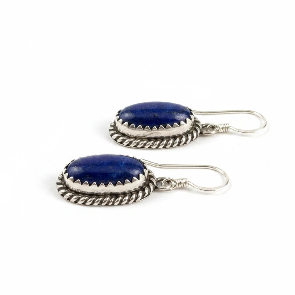 Wildflower Artisans oval lapis lazuli earrings in sterling silver with a handcrafted sawtooth bezel and twisted rope border.
