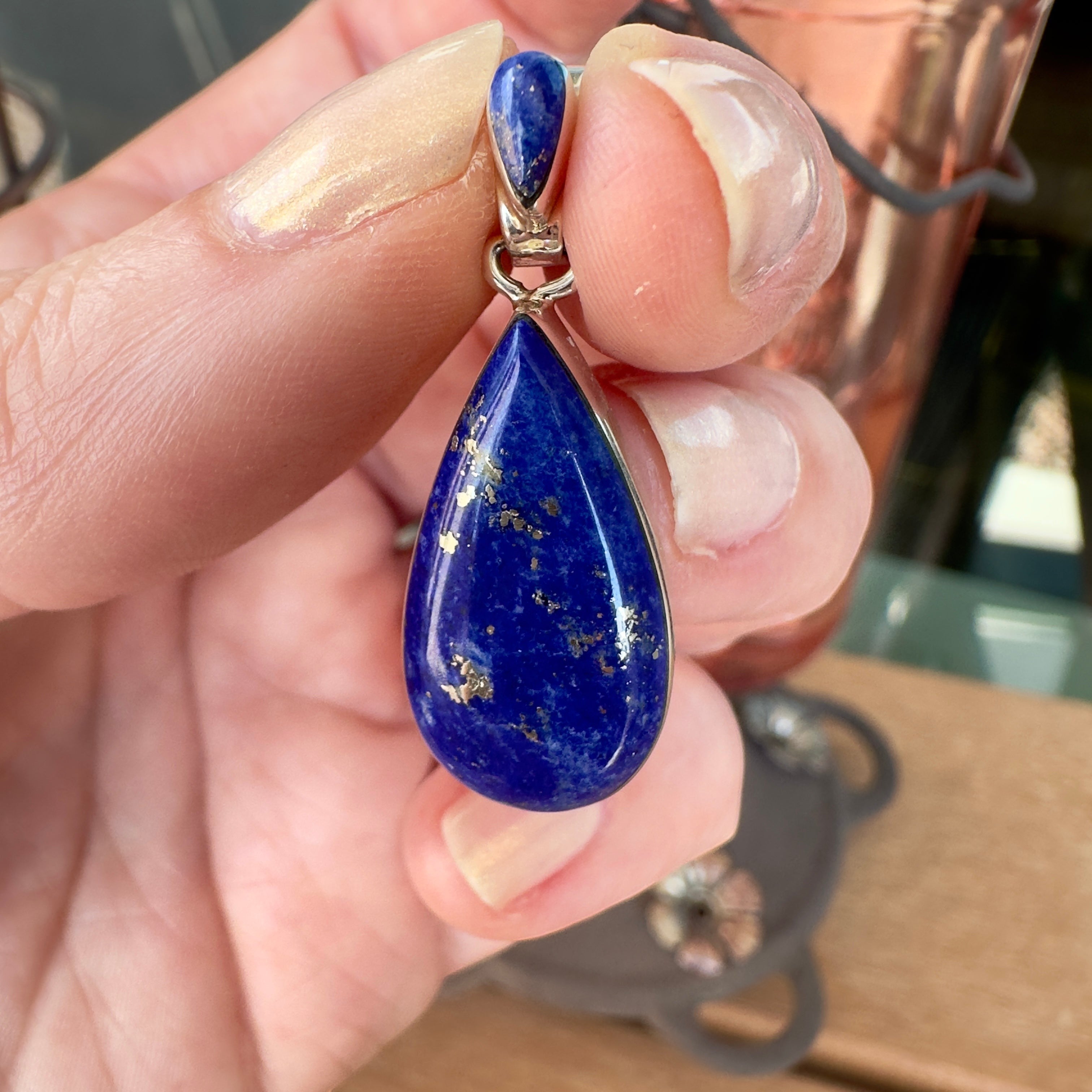 Wildflower Artisans Martinez teardrop lapis lazuli pendant with gold pyrite inclusions set in polished sterling silver.