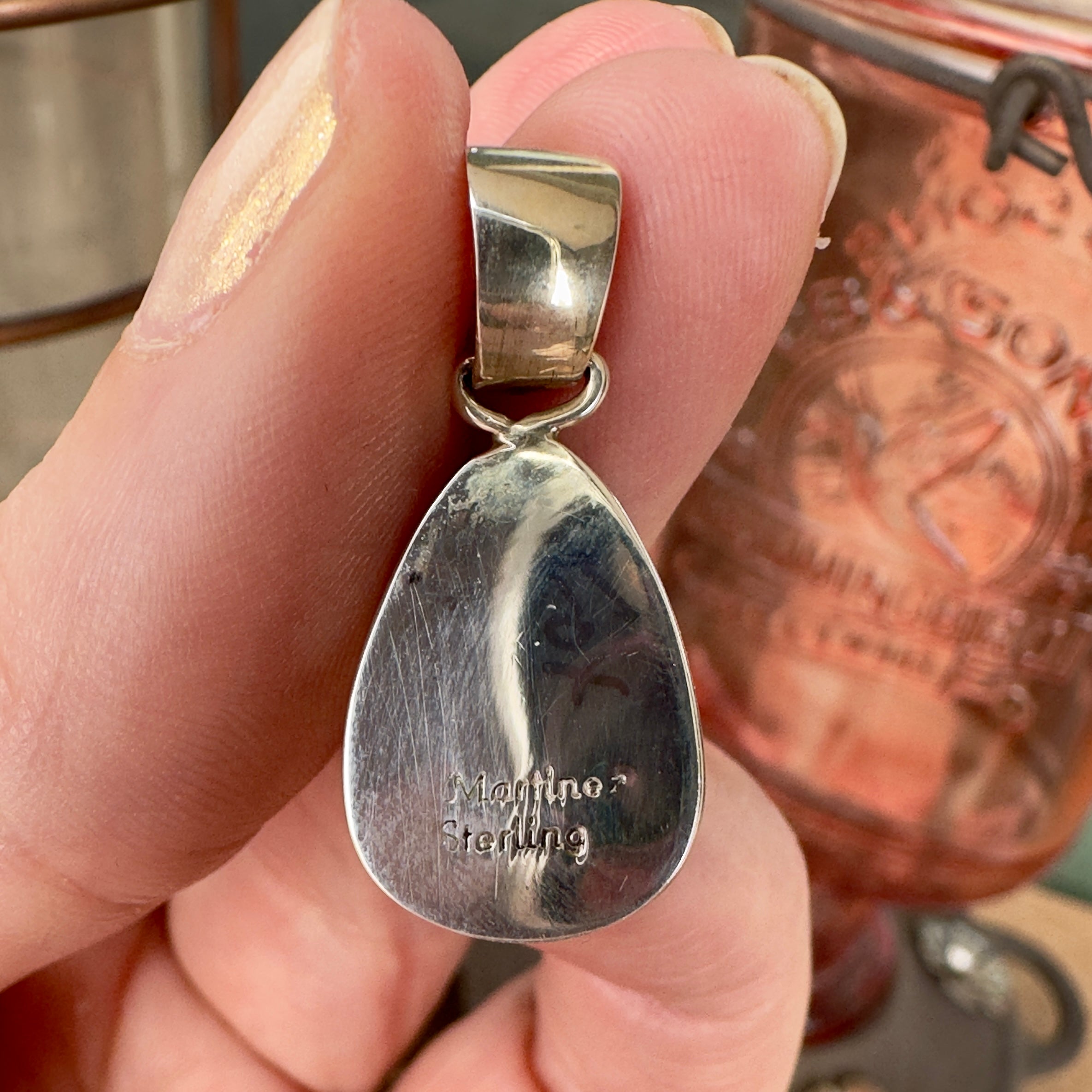 Wildflower Artisans Martinez Fox turquoise teardrop pendant in sterling silver, showing the hallmarked back view.