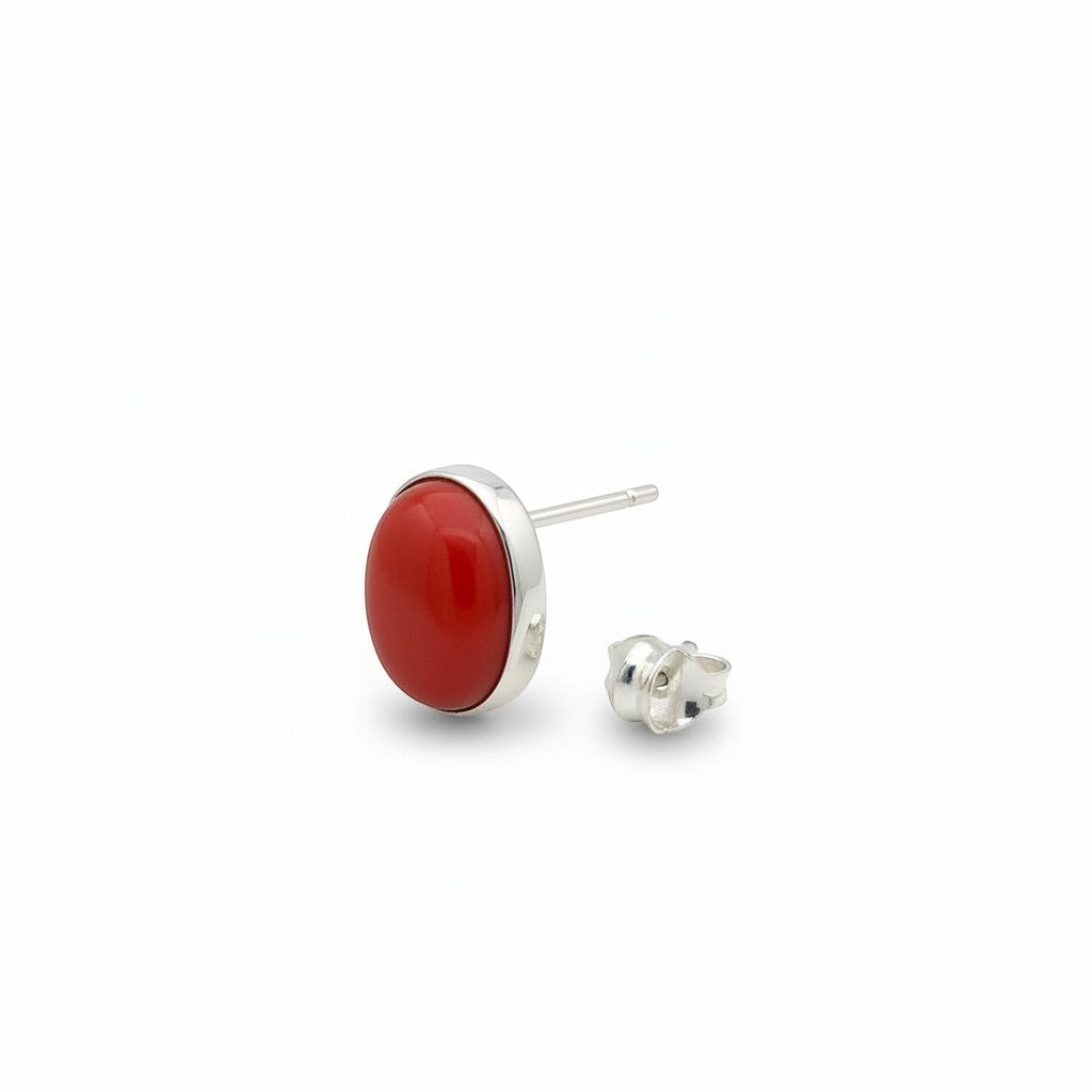 Wildflower Artisans oval spiny oyster stud earrings featuring a red-orange cabochon set in polished sterling silver.