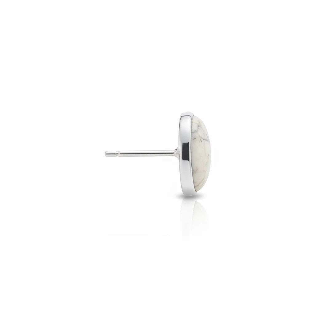 Wildflower Artisans oval white stone stud earrings set in polished sterling silver, side profile view.