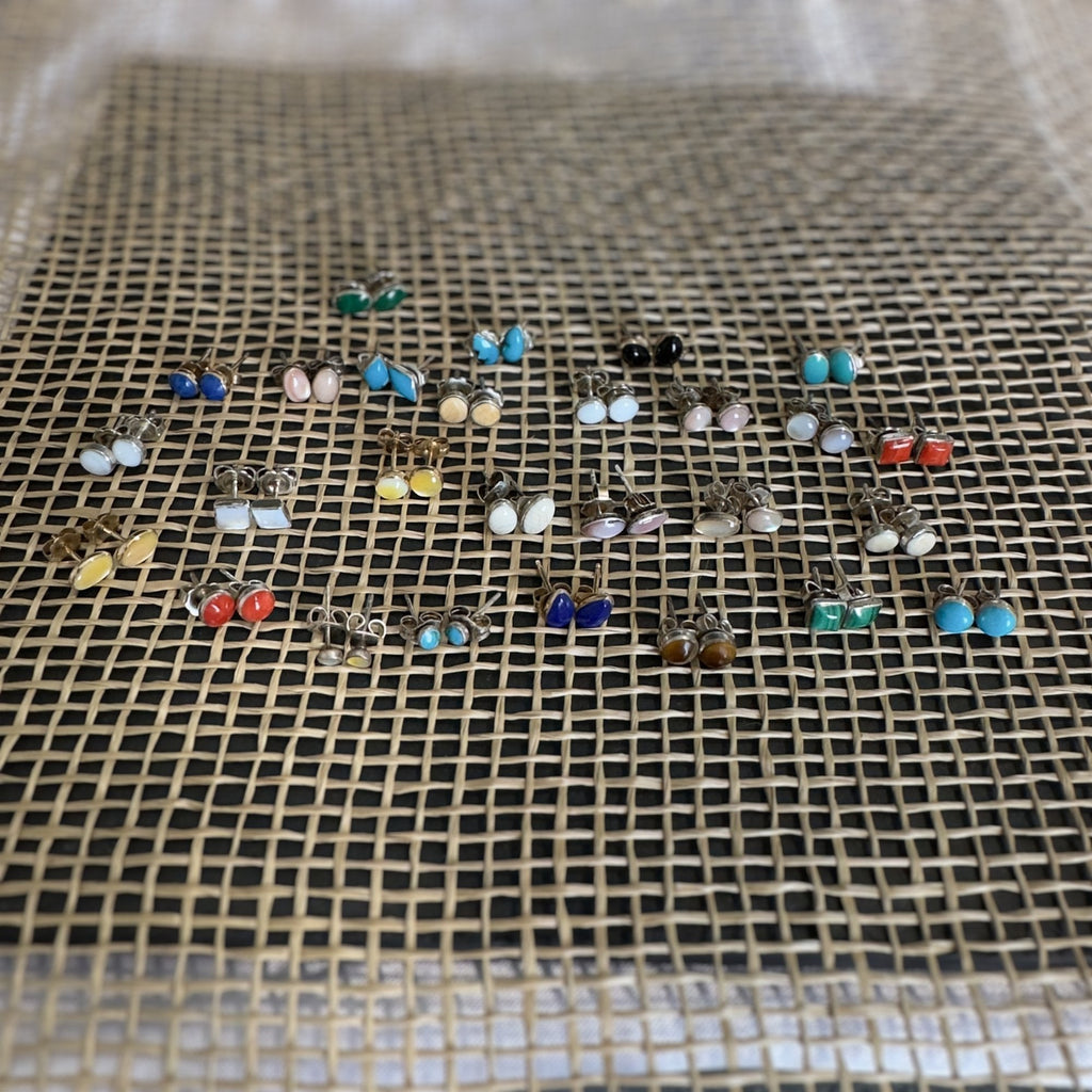Wildflower Artisans collection of handcrafted oval stone stud earrings in sterling silver with various natural gems.
