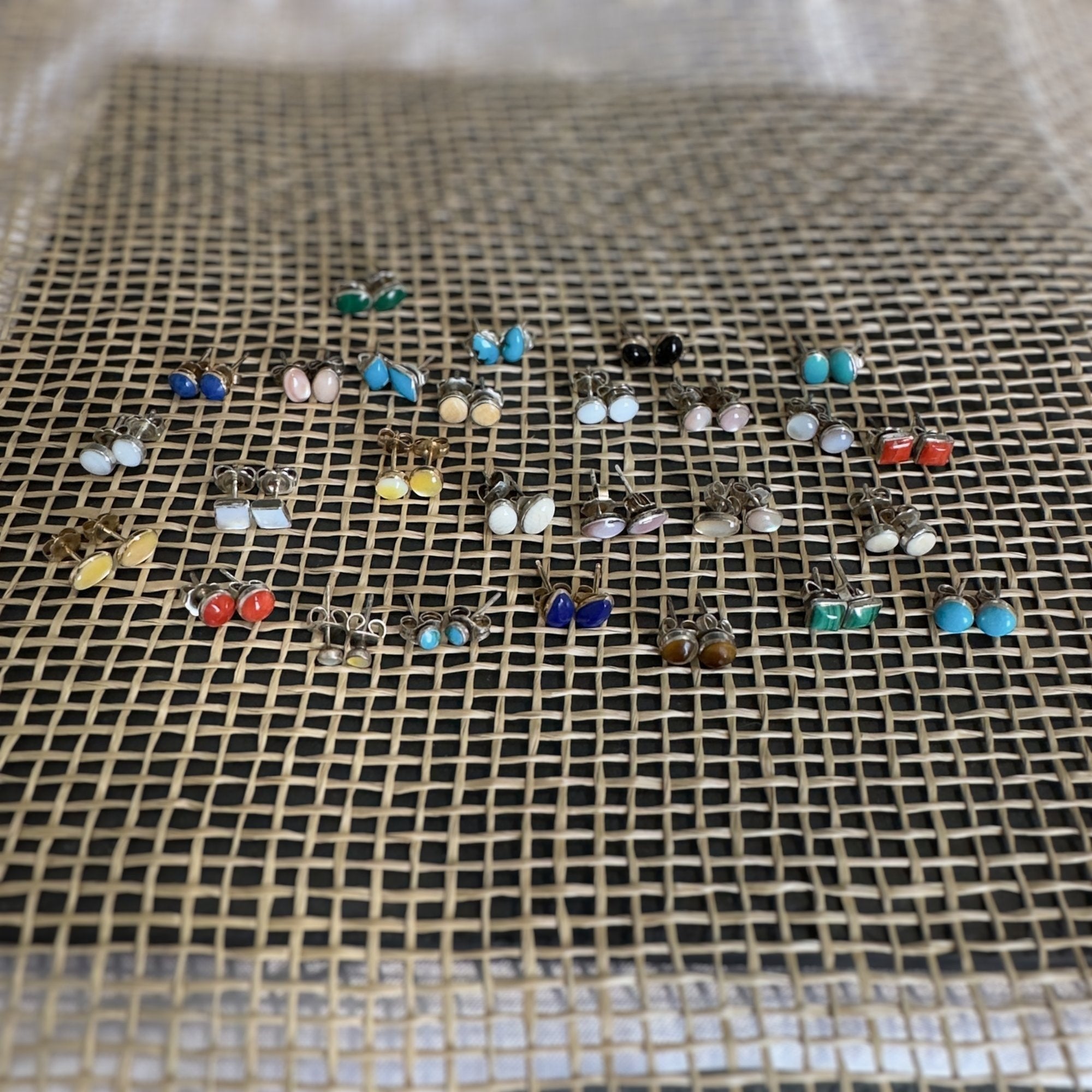 Wildflower Artisans collection of handcrafted oval stone stud earrings in sterling silver with various natural gems.