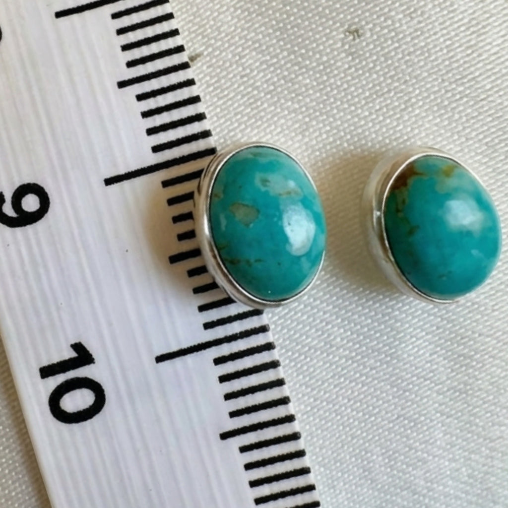 Wildflower Artisans oval turquoise stud earrings, approx. 10mm, set in sterling silver with natural matrix.