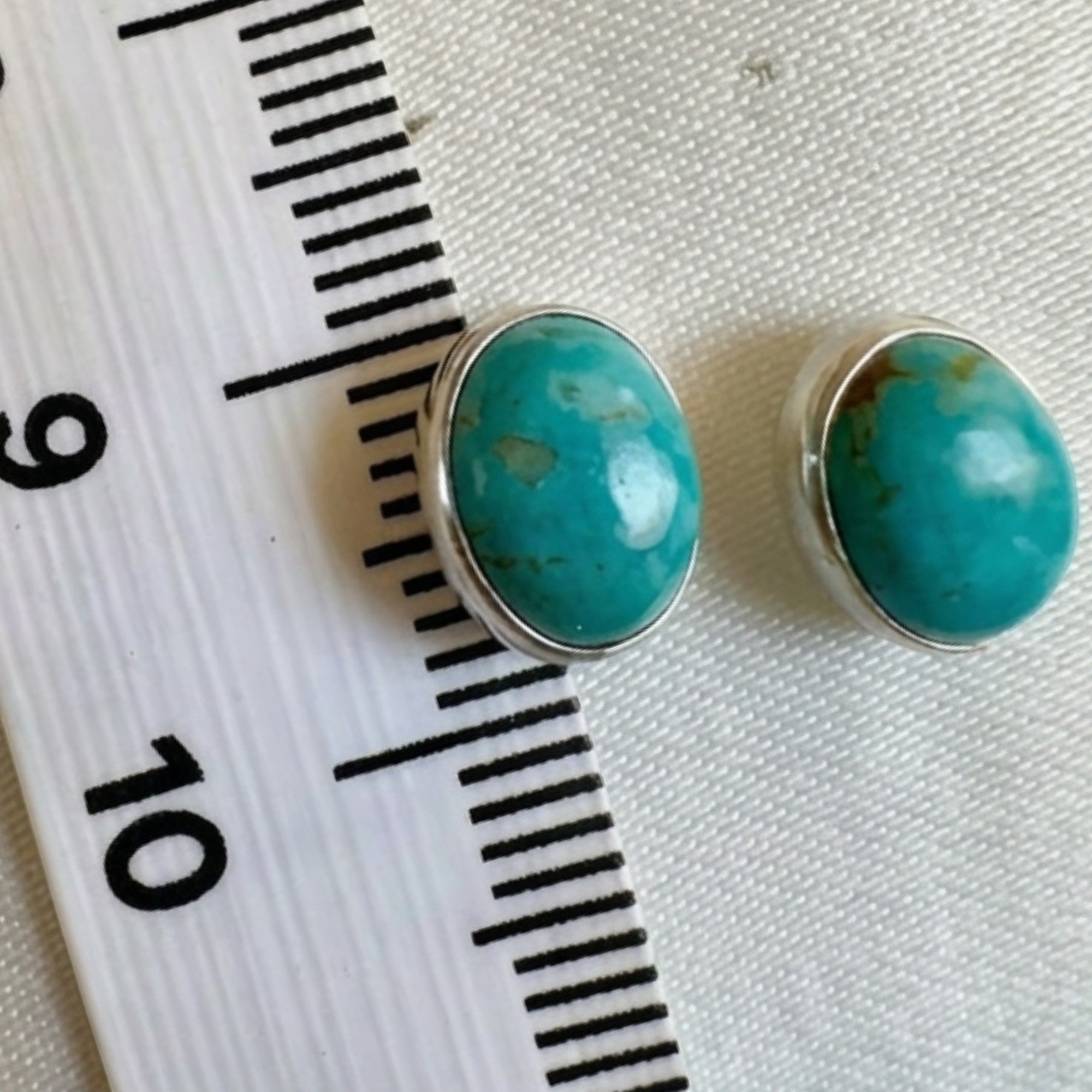 Wildflower Artisans oval turquoise stud earrings, approx. 10mm, set in sterling silver with natural matrix.