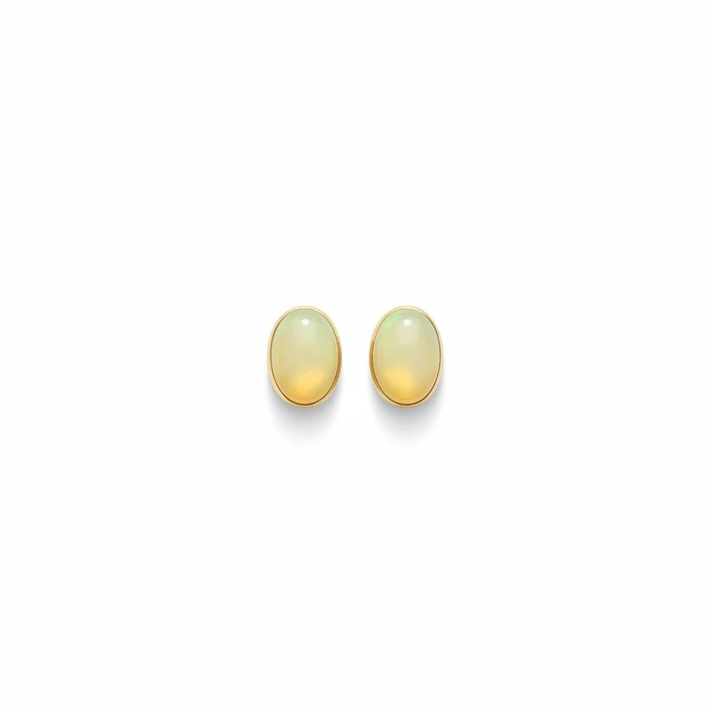 Wildflower Artisans oval yellow opal stud earrings set in 14K gold with a warm honey glow.