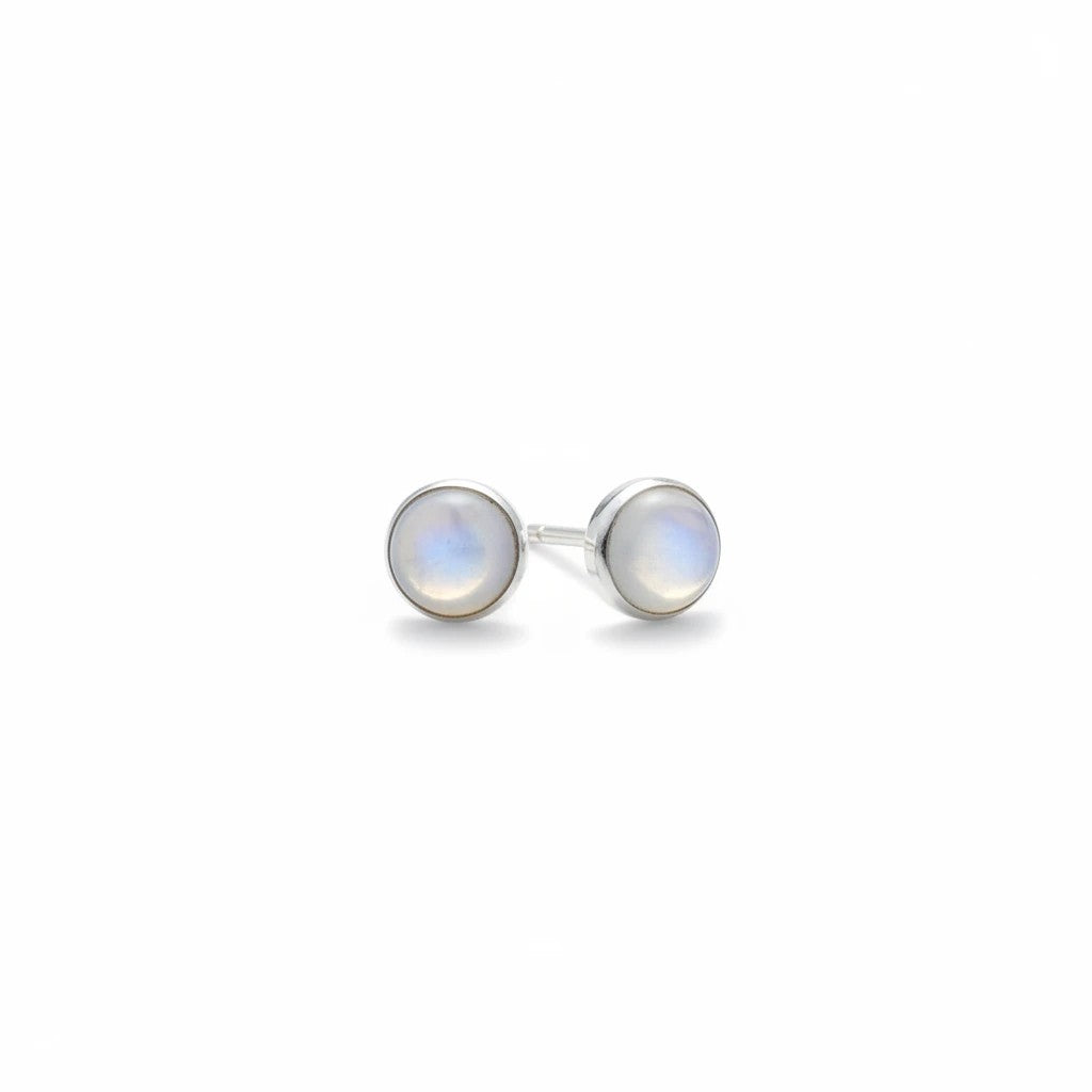 Wildflower Artisans round opal stud earrings set in polished sterling silver bezels with a soft iridescent glow.