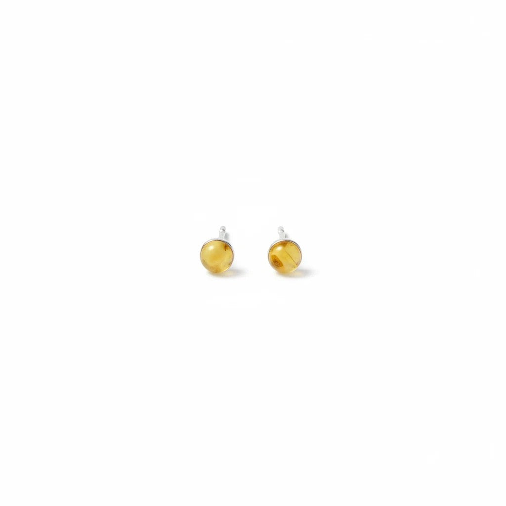 Wildflower Artisans round yellow opal stud earrings set in 14K gold with a warm honey glow.