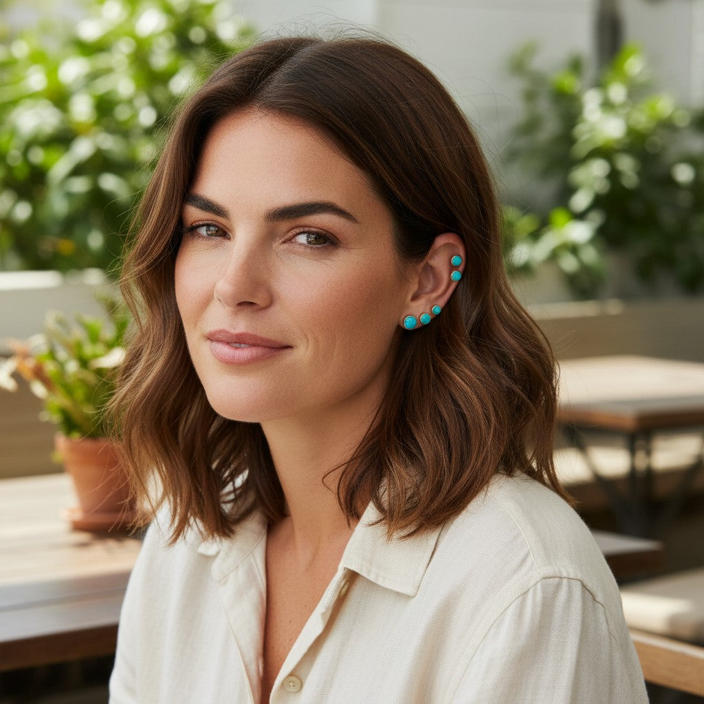 Wildflower Artisans Santa Fe set featuring turquoise stud earrings worn by a woman in a sunlit outdoor setting.