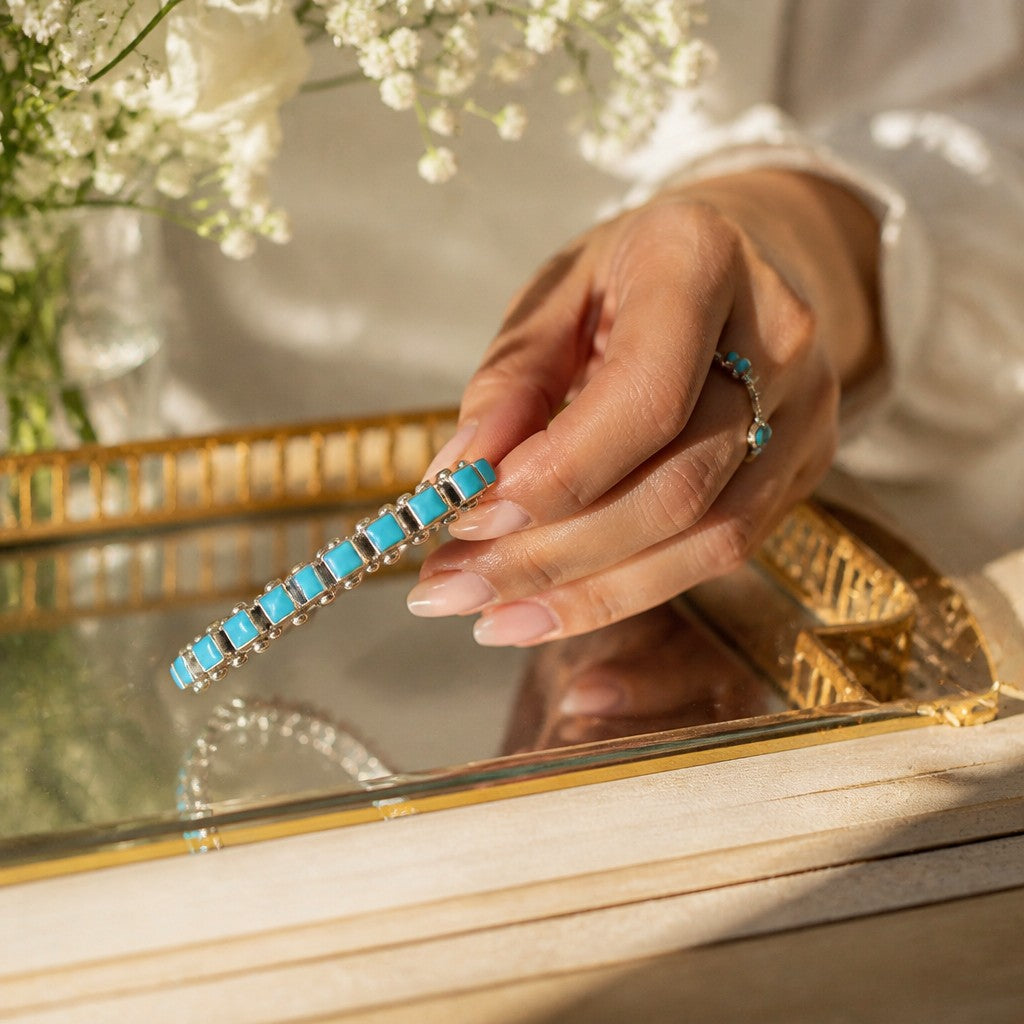 Wildflower Artisans sterling silver cuff bracelet featuring square Sleeping Beauty turquoise stones in robin egg blue.