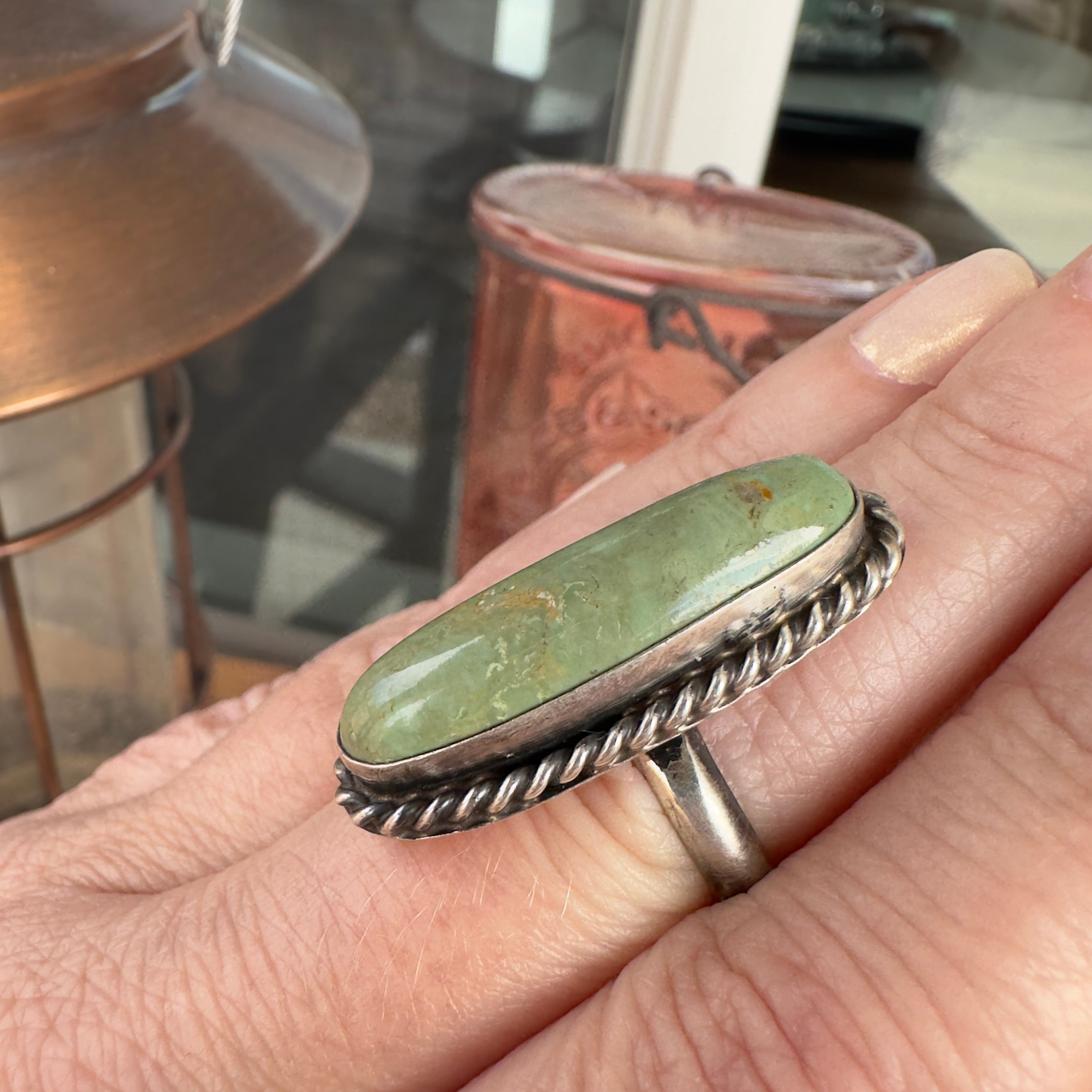 Wildflower Artisans long oval Sonoran Mountain turquoise ring in sage green with a twisted sterling silver rope bezel.