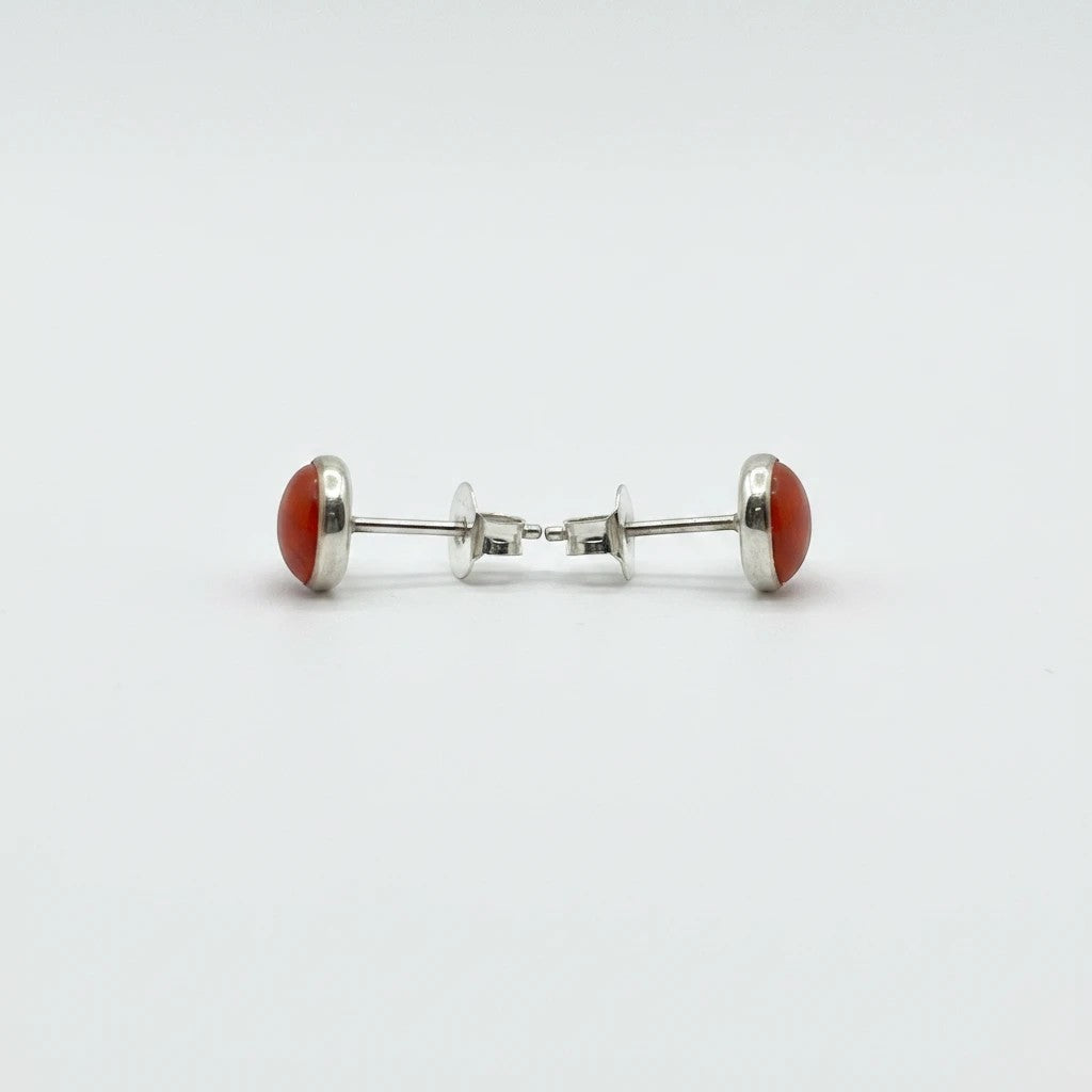 Wildflower Artisans round spiny oyster stud earrings with red-orange cabochons set in .925 sterling silver bezels.