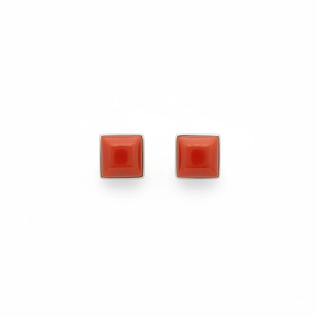 Wildflower Artisans square stud earrings featuring red-orange spiny oyster cabochons in a minimalist bezel setting.