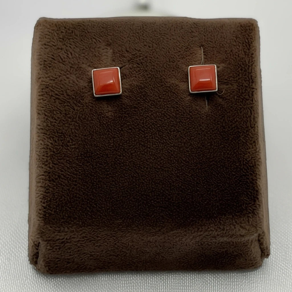 Wildflower Artisans square spiny oyster stud earrings featuring a red-orange domed cabochon set in sterling silver.