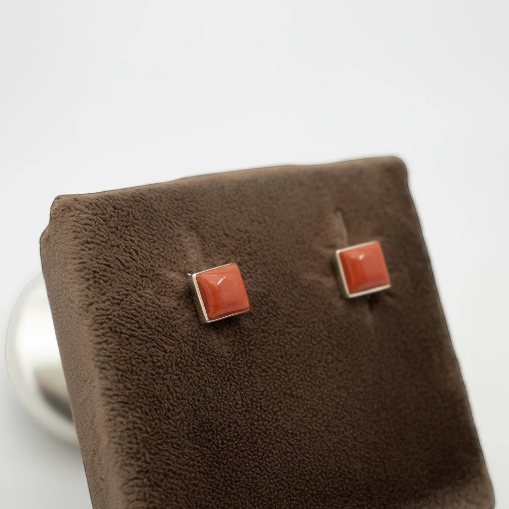 Wildflower Artisans square spiny oyster stud earrings with a red-orange domed cabochon set in sterling silver
