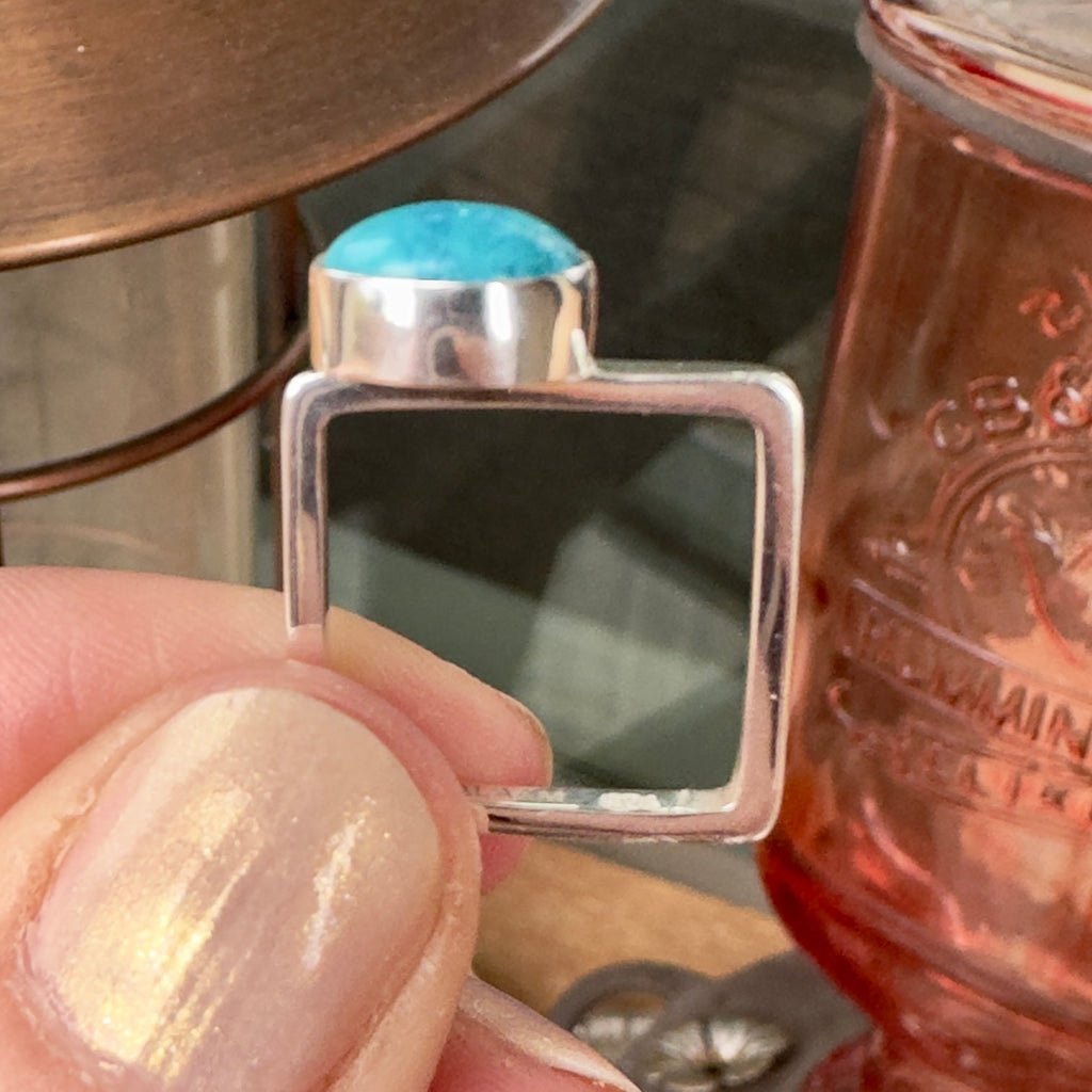 Wildflower Artisans BALAAM sterling silver square band ring featuring an off-center sky blue turquoise cabochon stone.