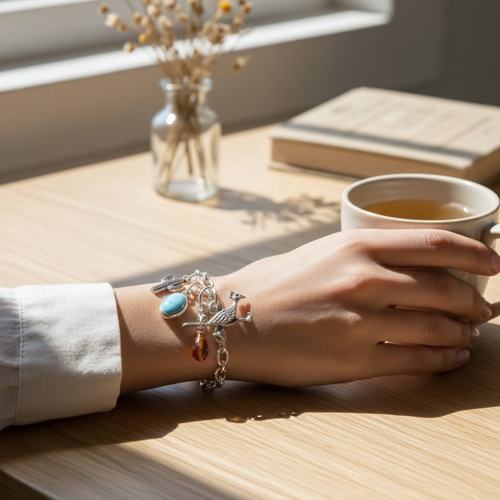Wildflower Artisans vintage sterling silver roadrunner charm on a bracelet with turquoise and amber accents