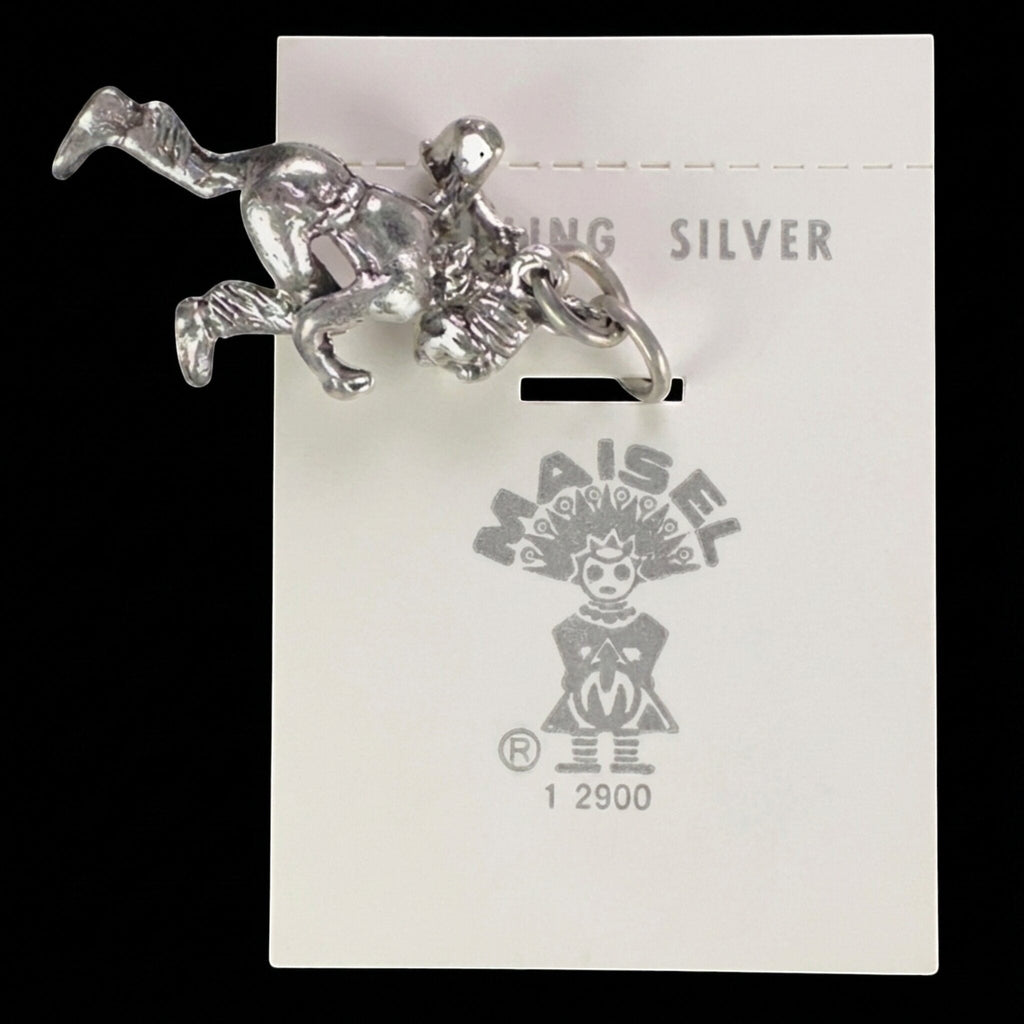 Wildflower Artisans vintage sterling silver dancer charm on original Maisel's trading post display card.