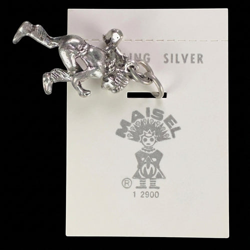 Wildflower Artisans vintage sterling silver dancer charm on original Maisel's trading post display card.