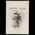 Wildflower Artisans vintage sterling silver dancer charm with headdress on original Maisel's trading post display card.