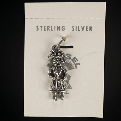 Wildflower Artisans vintage sterling silver standing figure charm on original Maisel's trading post display card