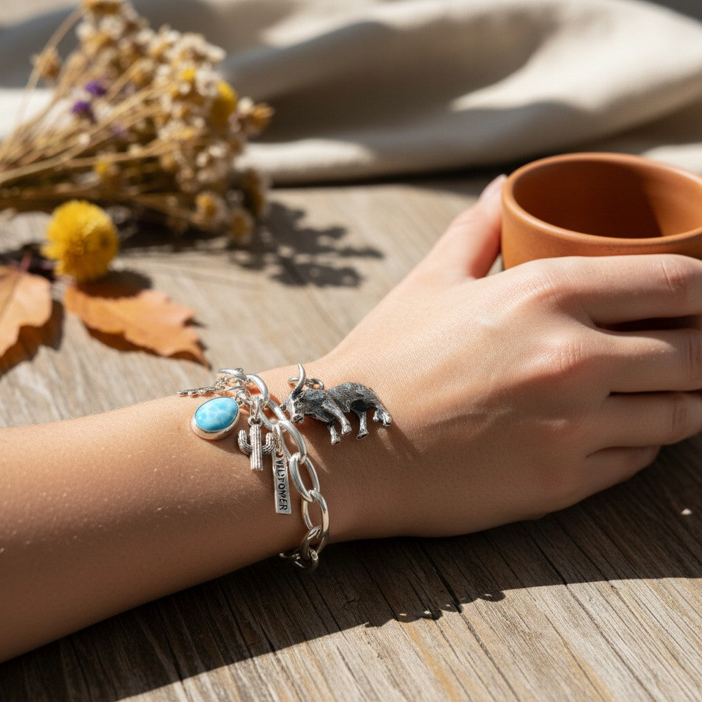 Wildflower Artisans sterling silver longhorn steer charm on a chain bracelet with a turquoise stone and cactus charm