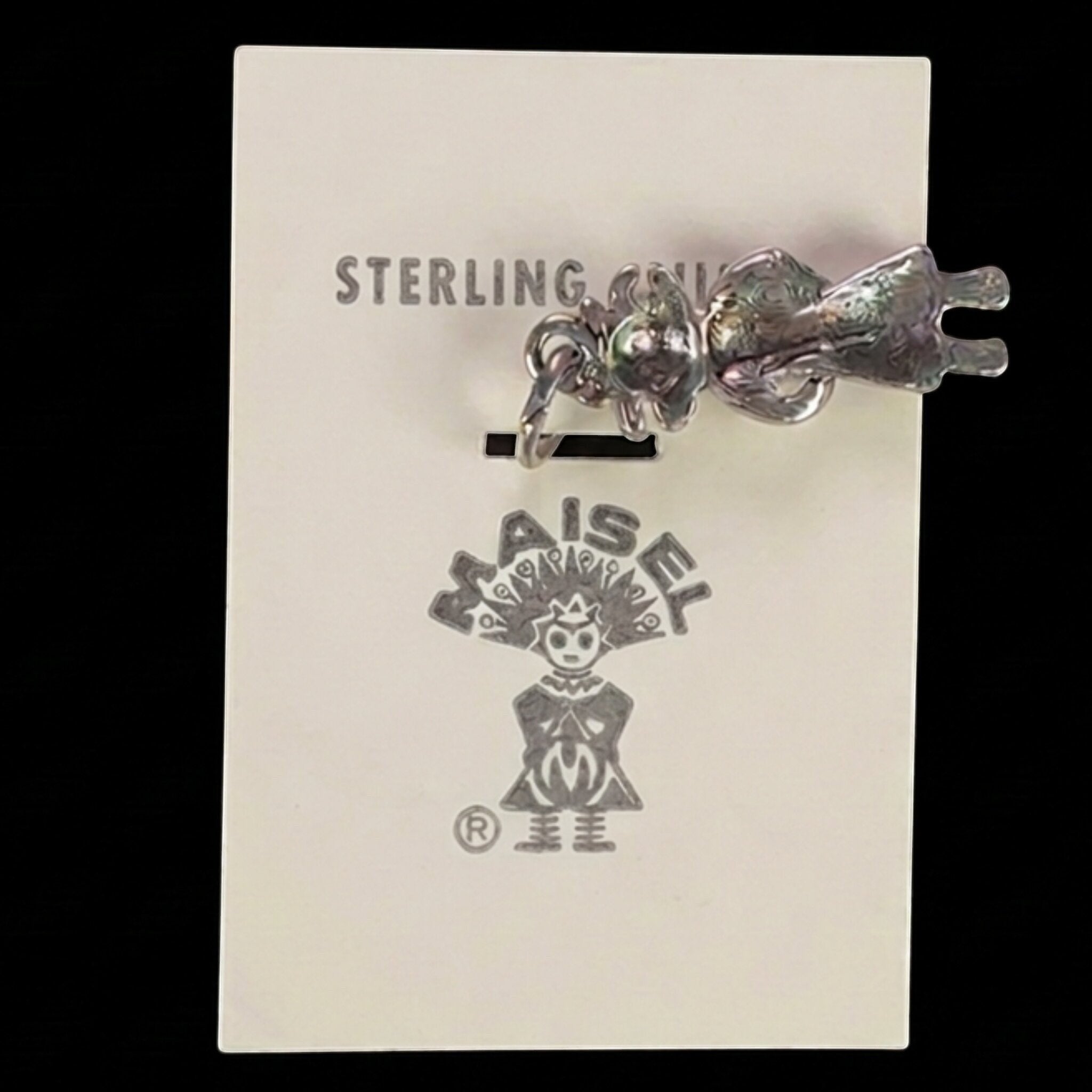 Wildflower Artisans vintage sterling silver Maisel's standing figure charm on original store card