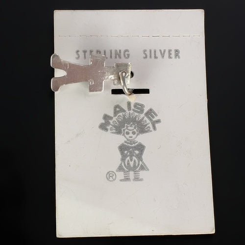 Wildflower Artisans vintage sterling silver Maisel's figure charm with a turquoise cabochon on original display card.
