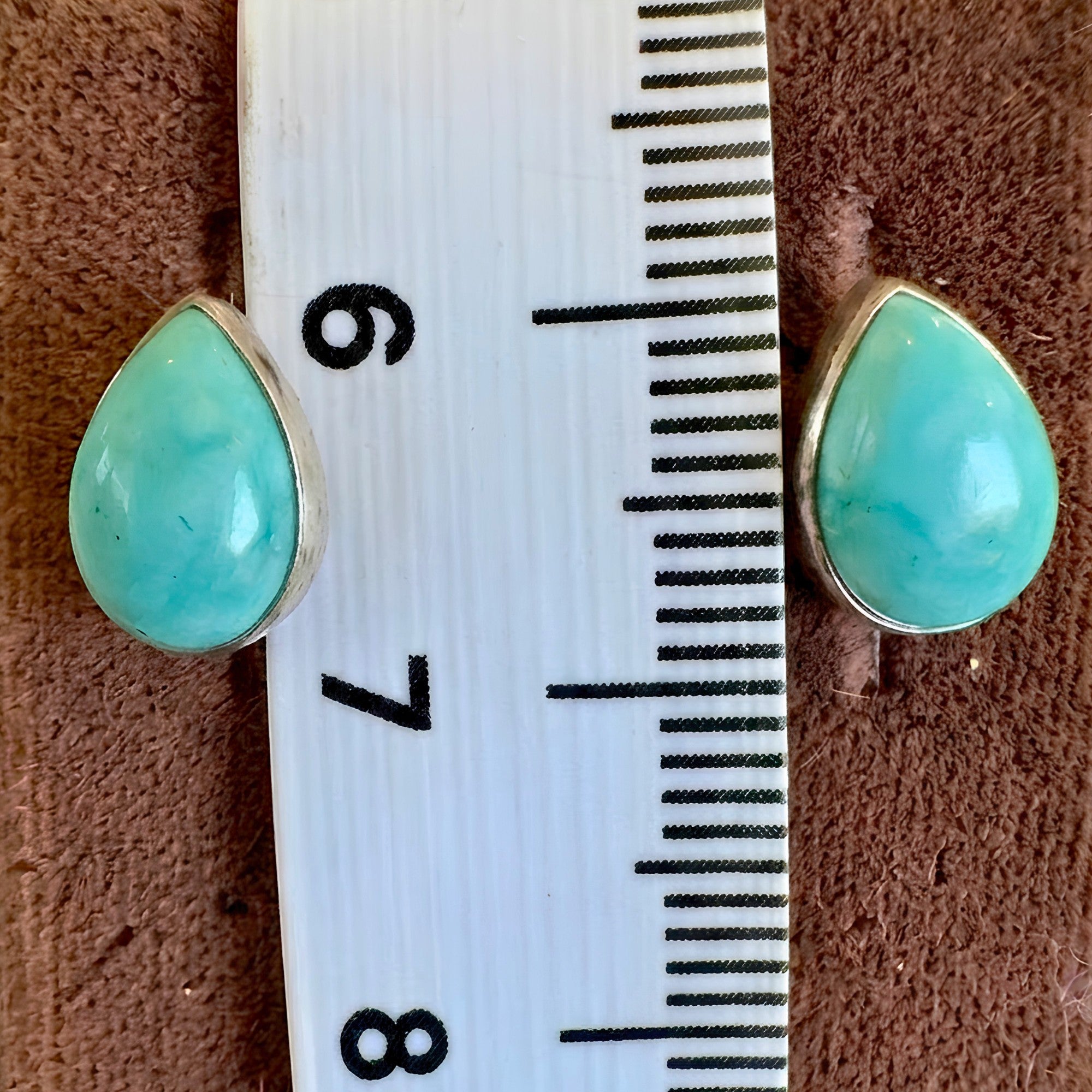 Wildflower Artisans teardrop turquoise stud earrings, approx. 10mm, set in sterling silver. One of a kind.