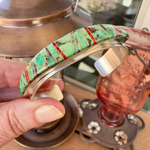 Wildflower Artisans sterling silver cuff featuring channel inlay of sage green Sonoran Mountain turquoise and red opal