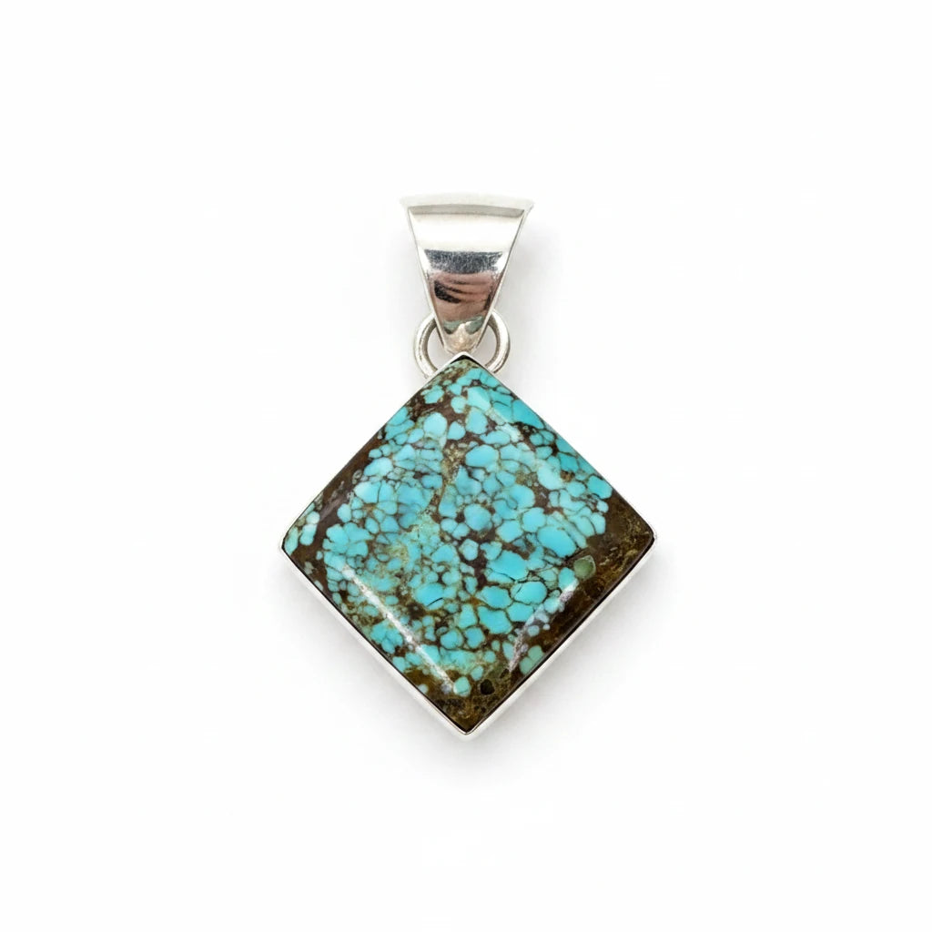 Wildflower Artisans square Number 8 spiderweb turquoise pendant set in sterling silver on a white background.