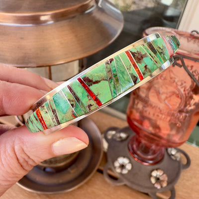 Wildflower Artisans sterling silver cuff featuring channel inlay of sage green Sonoran Mountain turquoise and red opal.