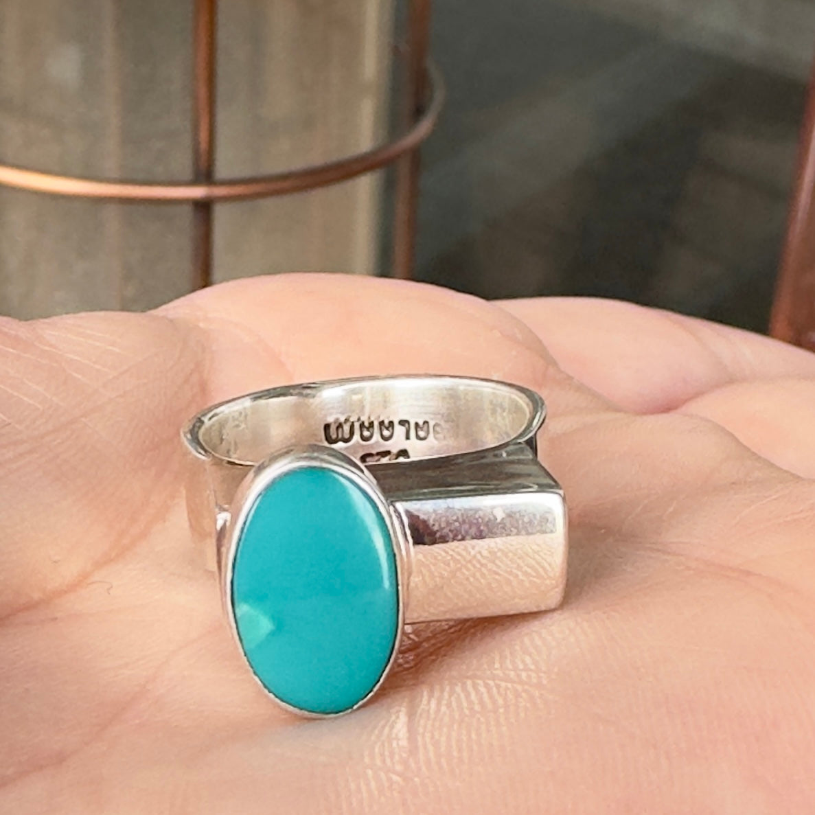 Wildflower Artisans BALAAM sterling silver ring with an oval teal turquoise cabochon on a wide flat architectural band