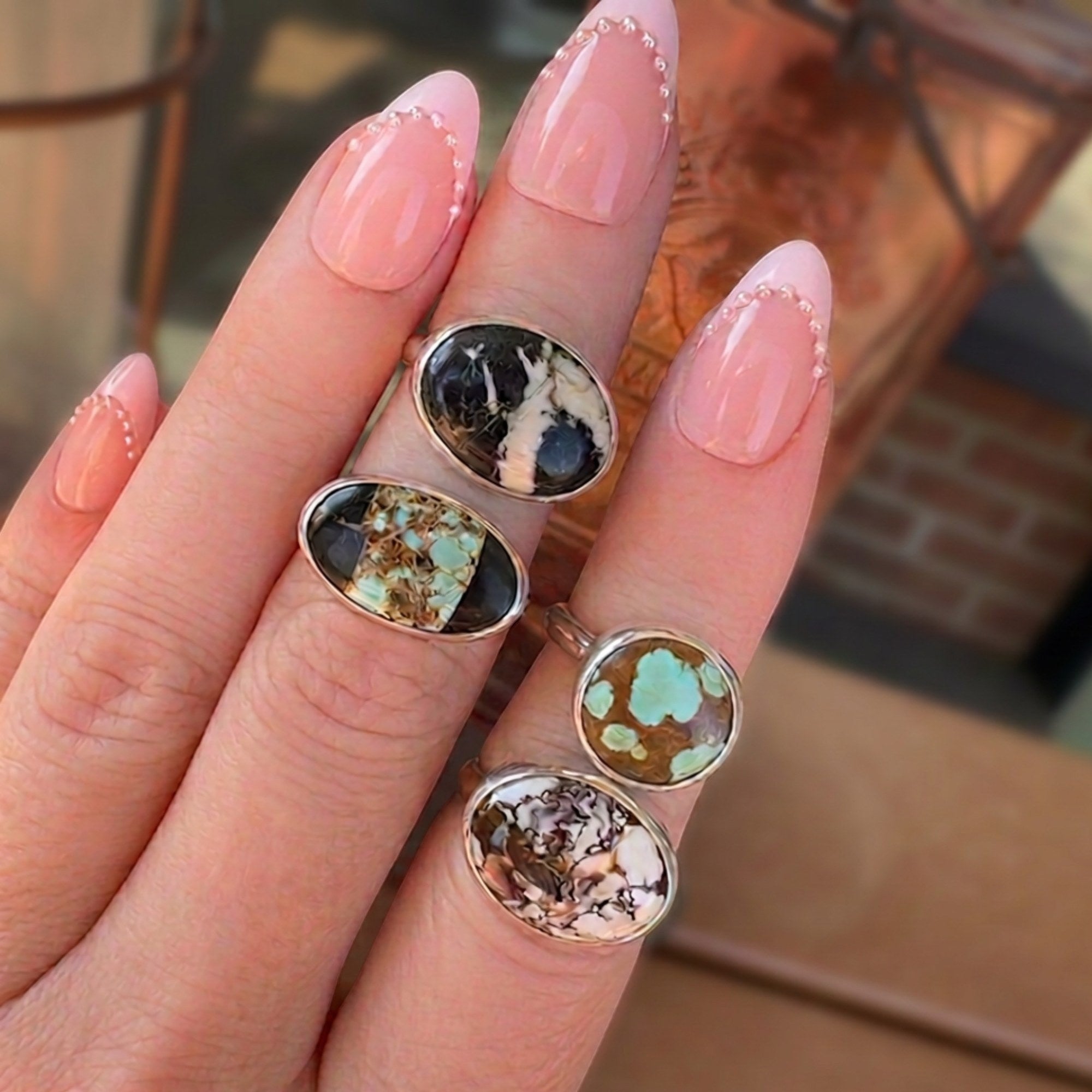 Wildflower Artisans sterling silver rings featuring various natural turquoise stones with unique matrix patterns