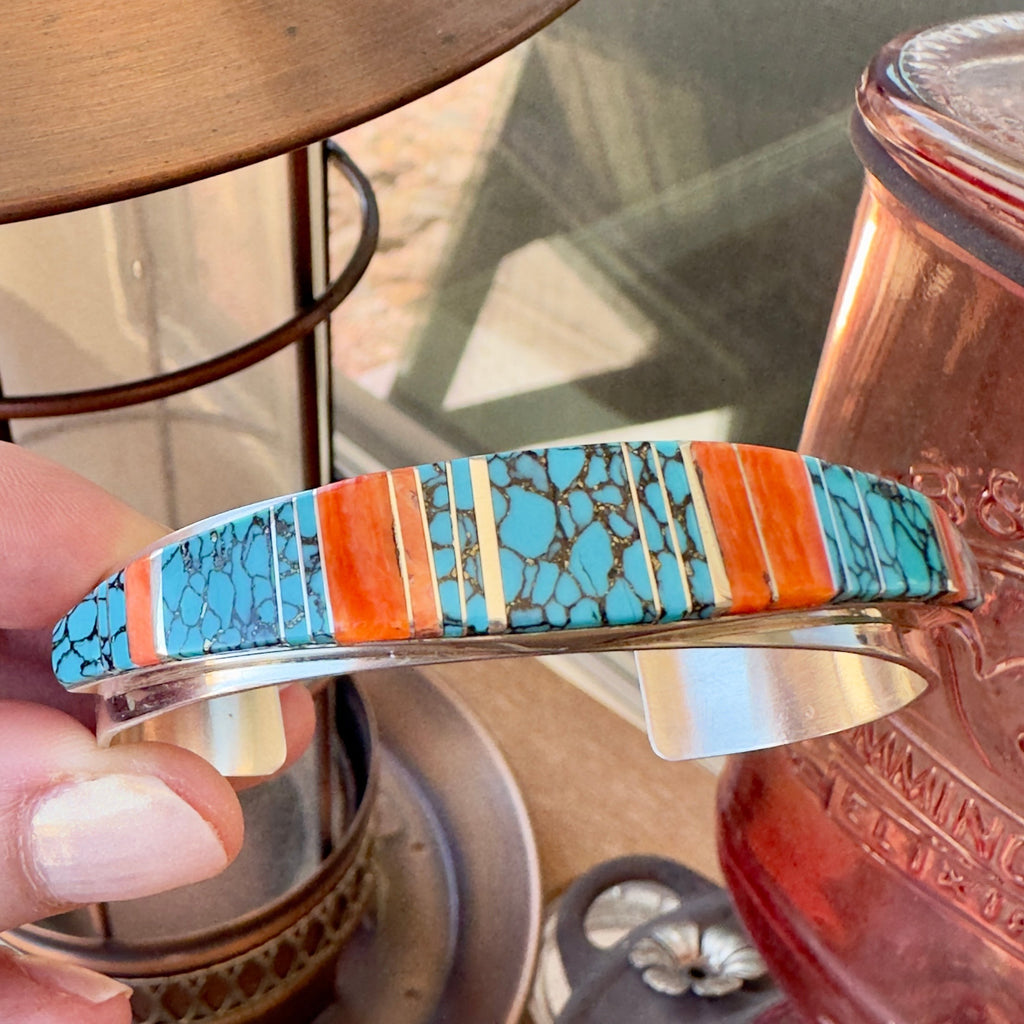 Wildflower Artisans sterling silver cuff bracelet with hand-inlaid turquoise and spiny oyster stone segments.