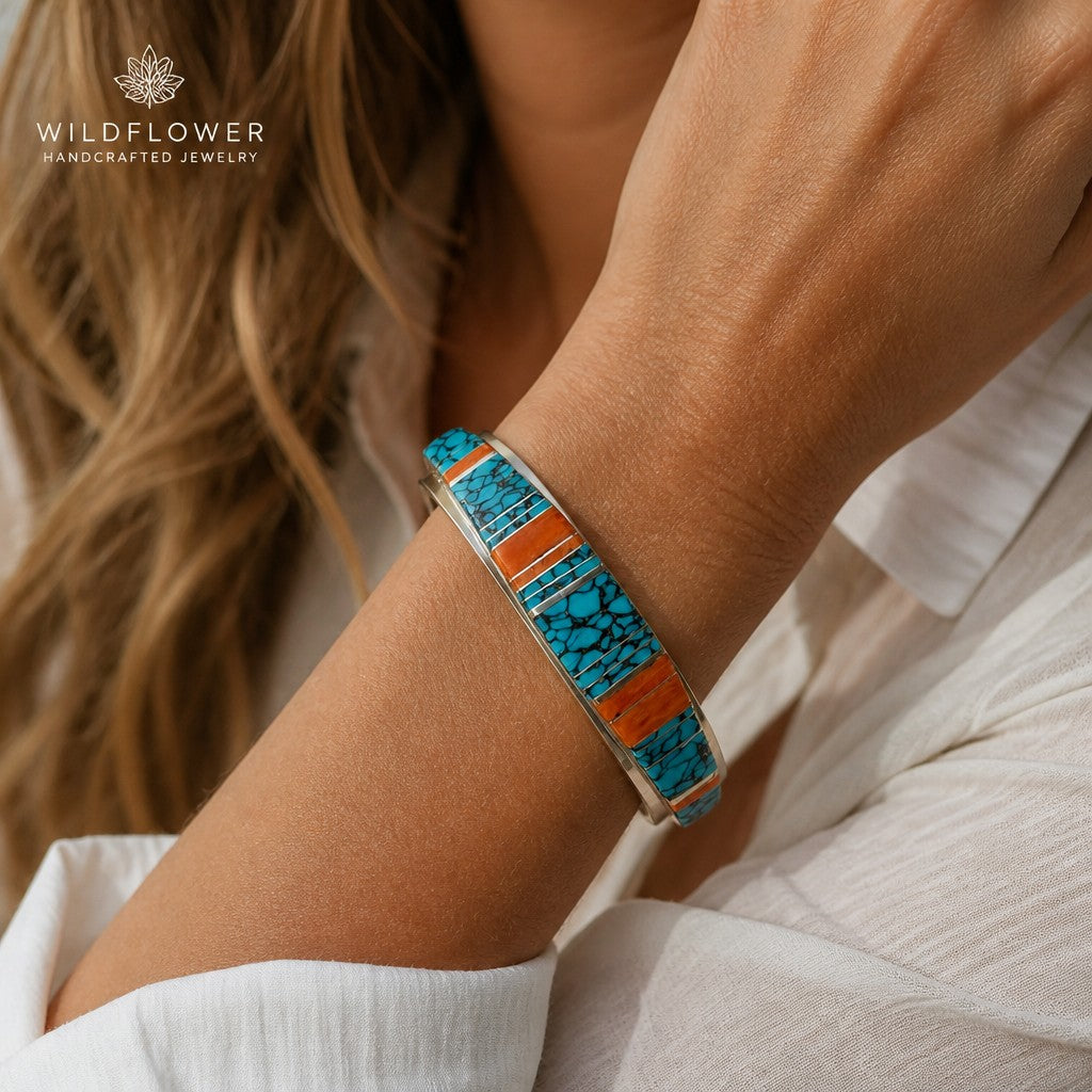 Wildflower Artisans sterling silver cuff bangle featuring hand-inlaid turquoise and orange spiny oyster stones.