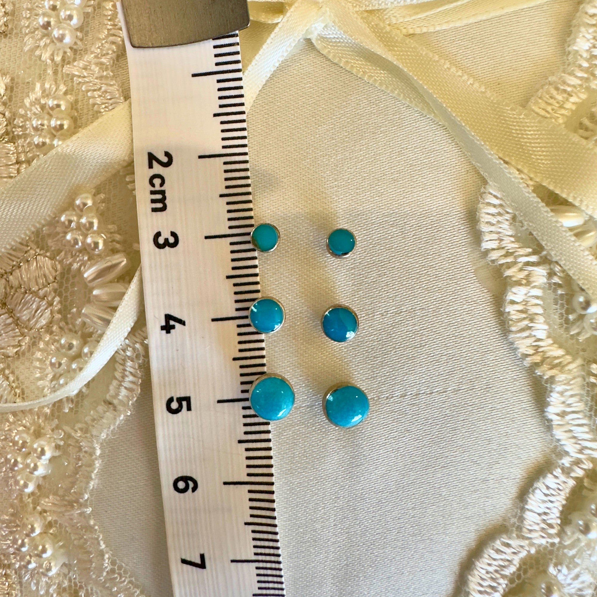 Wildflower Artisans turquoise stud earrings in sterling silver, shown in 3mm, 4mm, and 5mm sizes.