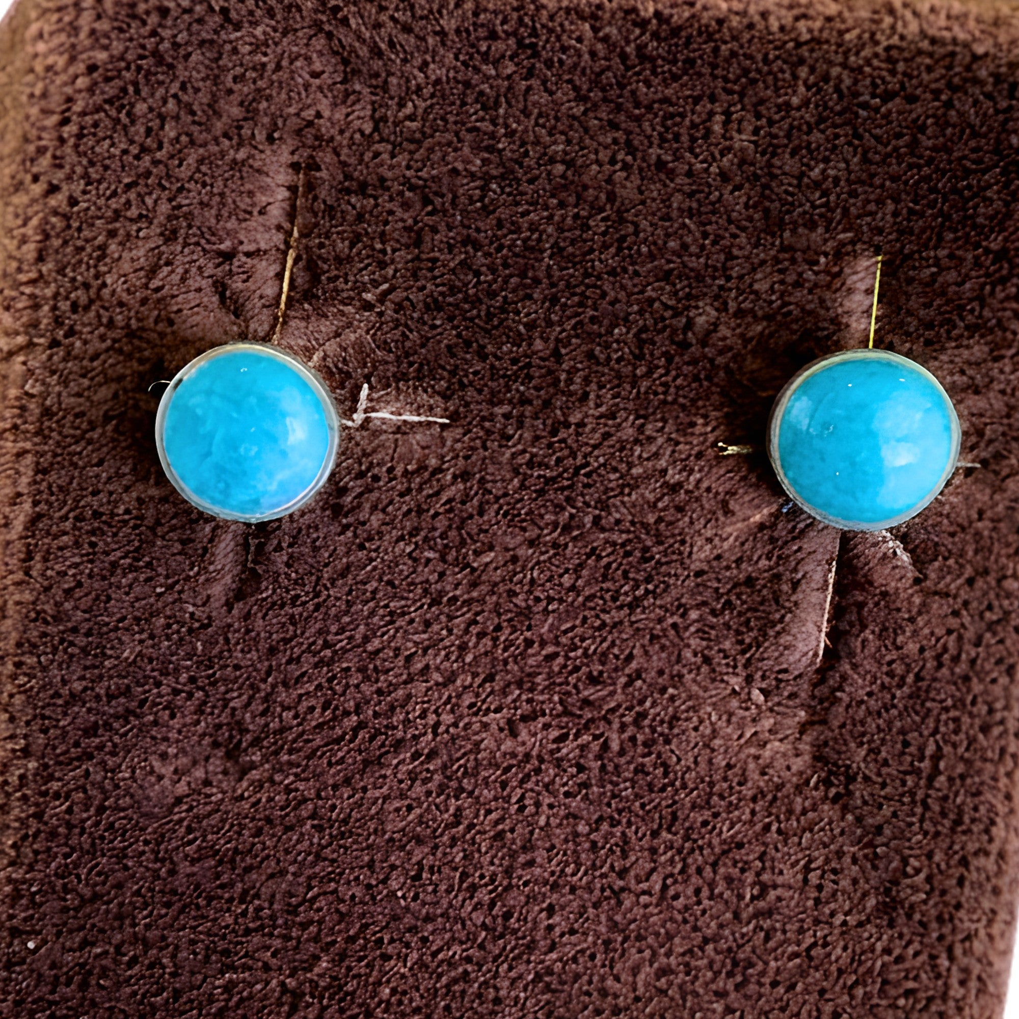 Wildflower Artisans small turquoise stud earrings in sterling silver setting. Genuine natural turquoise cabochons.