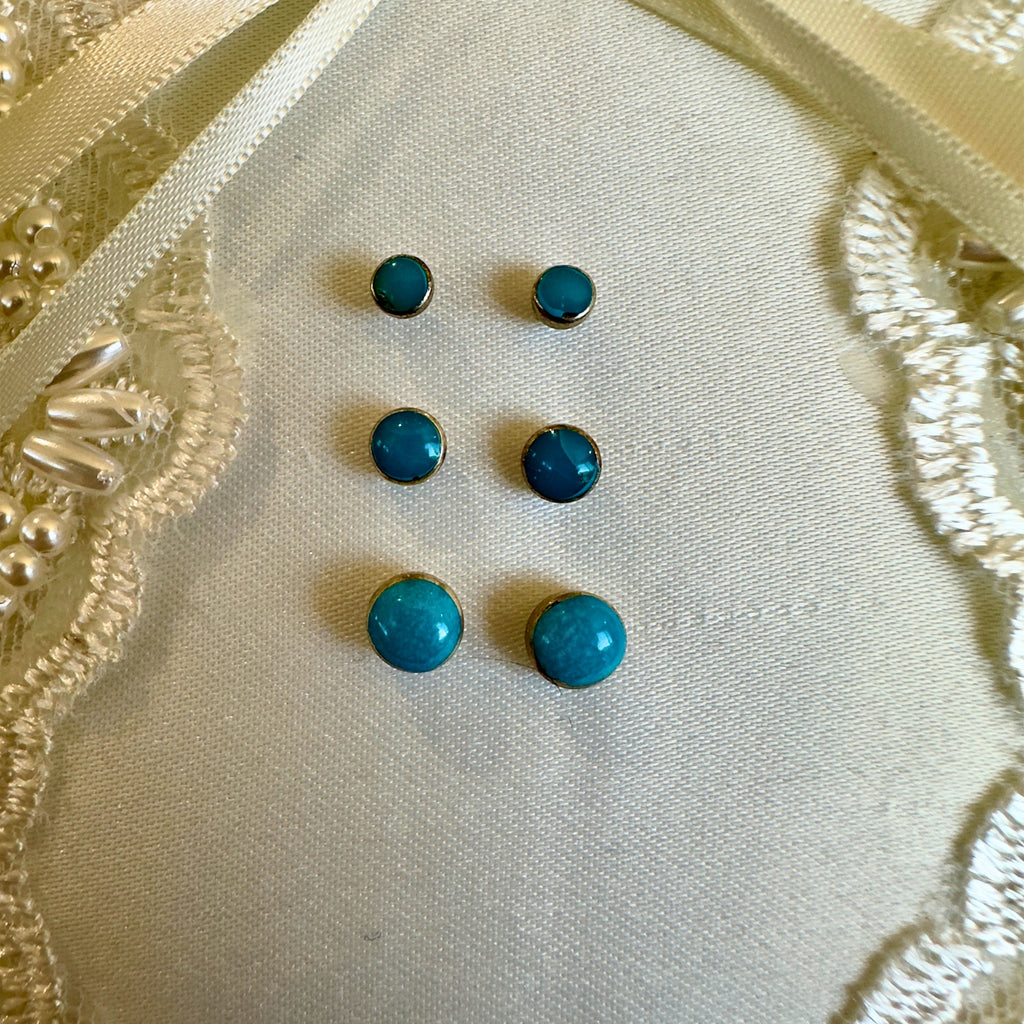 Wildflower Artisans turquoise stud earrings in sterling silver, shown in three sizes. Genuine natural turquoise.