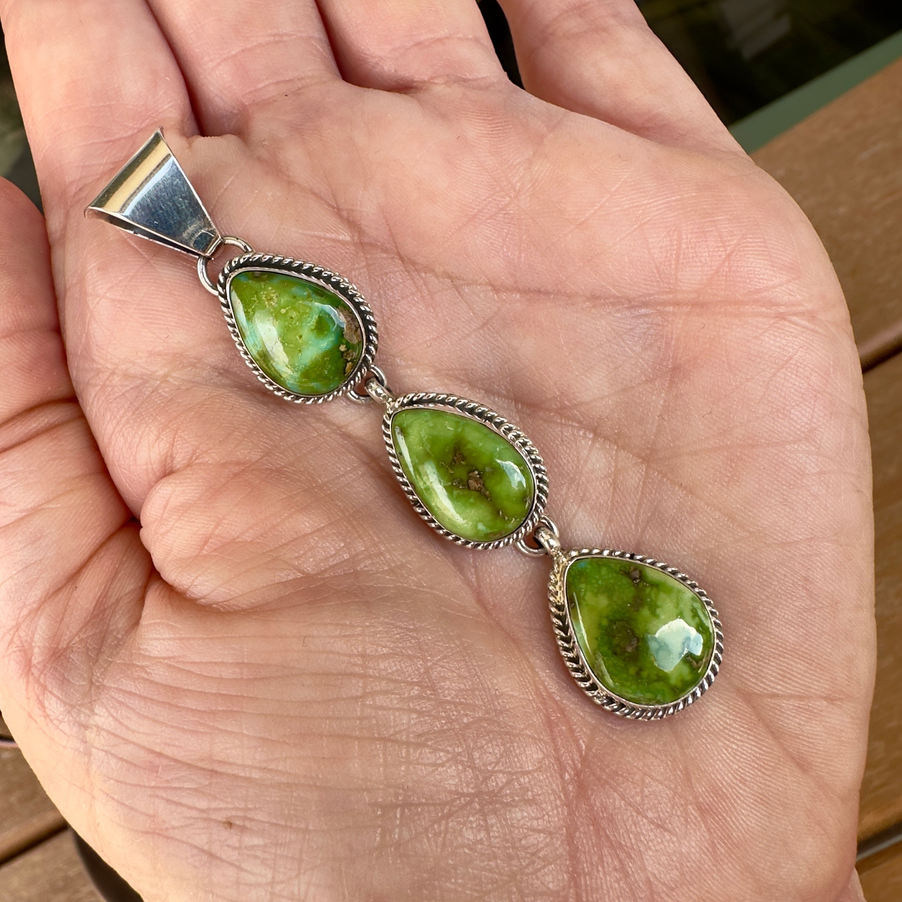 Wildflower Artisans C. Wylle triple teardrop Sonoran Mountain turquoise pendant in sterling silver with rope bezel detail.
