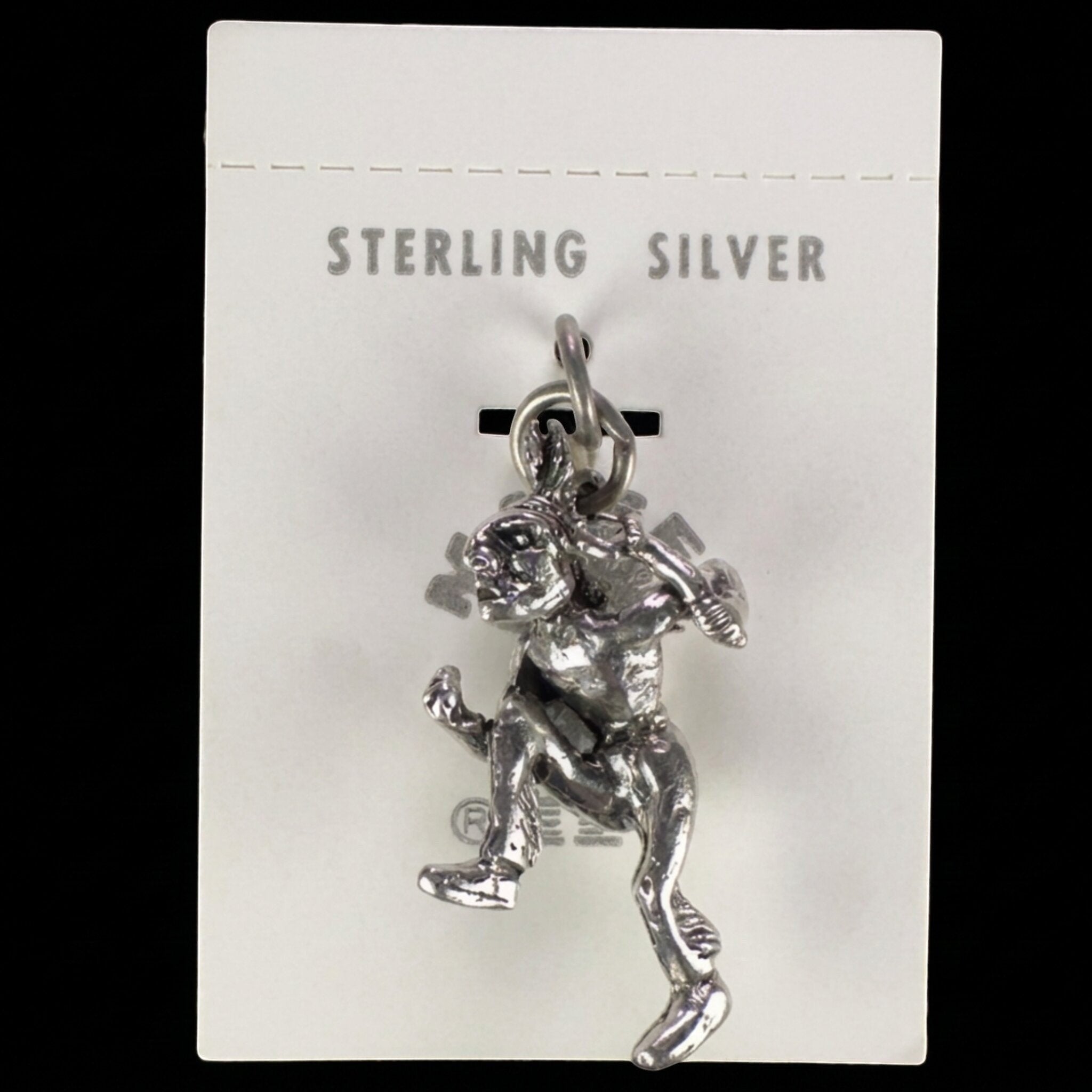 Wildflower Artisans vintage sterling silver dancer charm on original Maisel's trading post display card