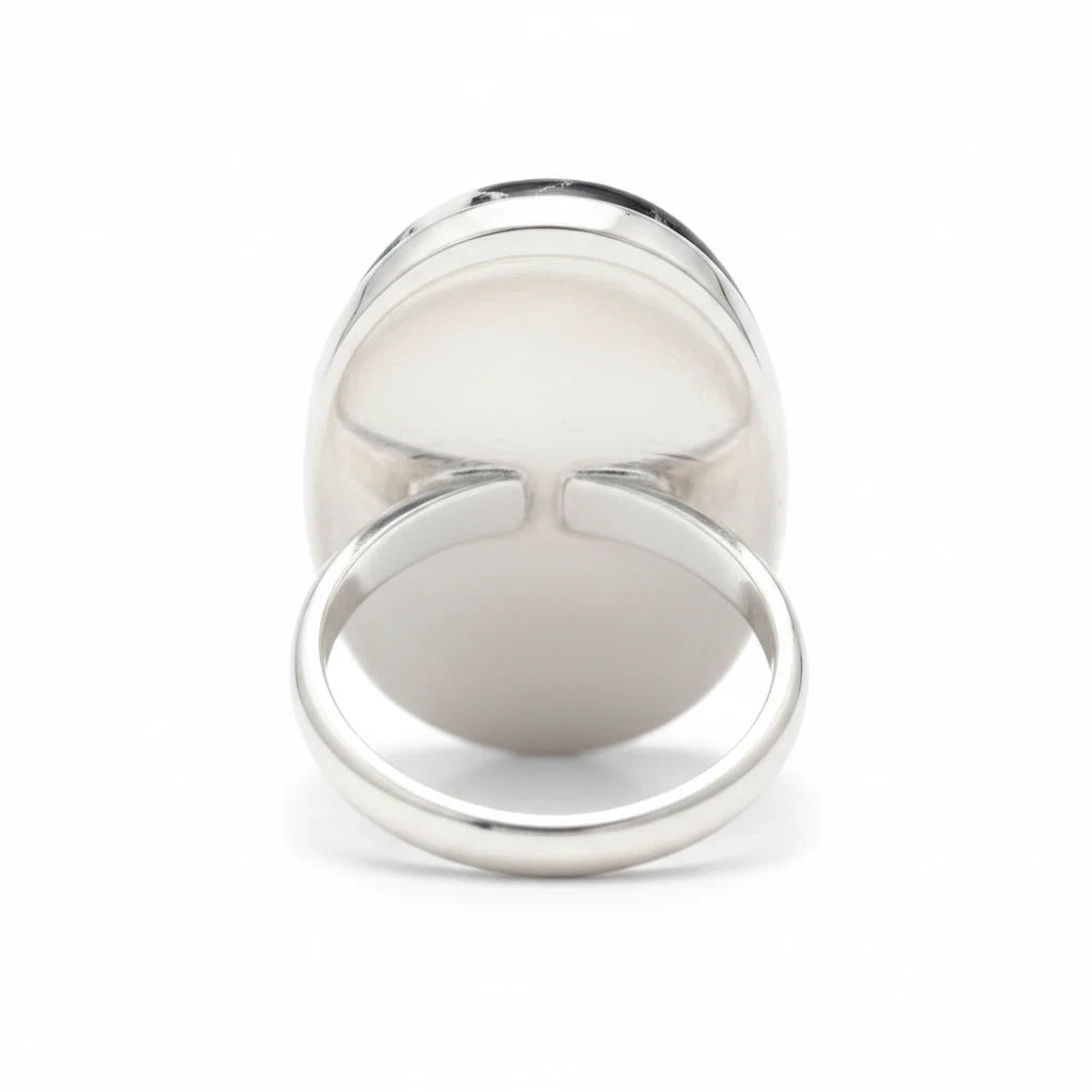 Wildflower Artisans sterling silver ring featuring an oval White Buffalo stone with black matrix, back view.